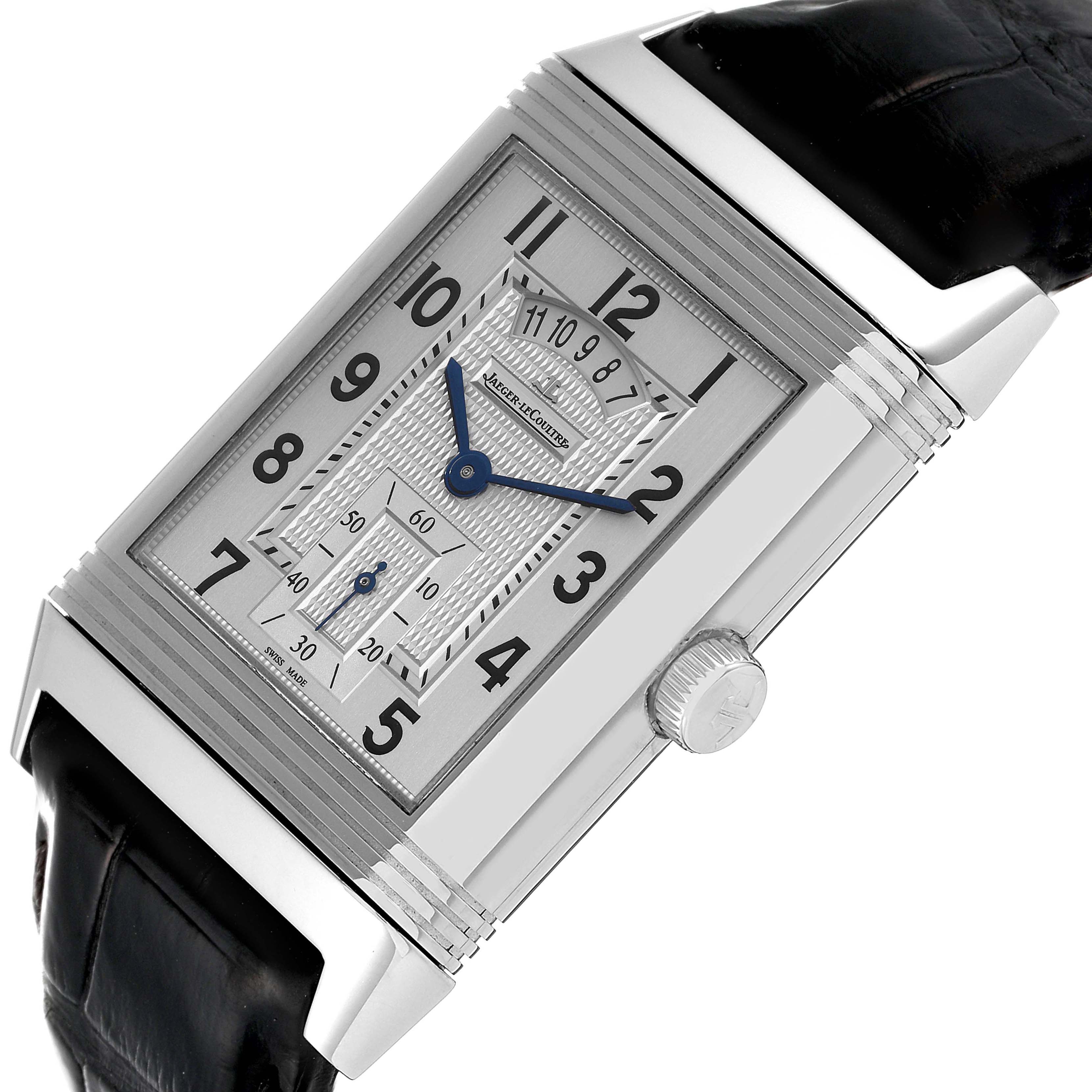 The image shows a close-up angled view of the Jaeger LeCoultre Reverso Q3748421 Men's Stainless Steel Silver Dial Q3748421 Men's Stainless Steel Silver Dial watch, highlighting its dial, crown, and part of the strap.