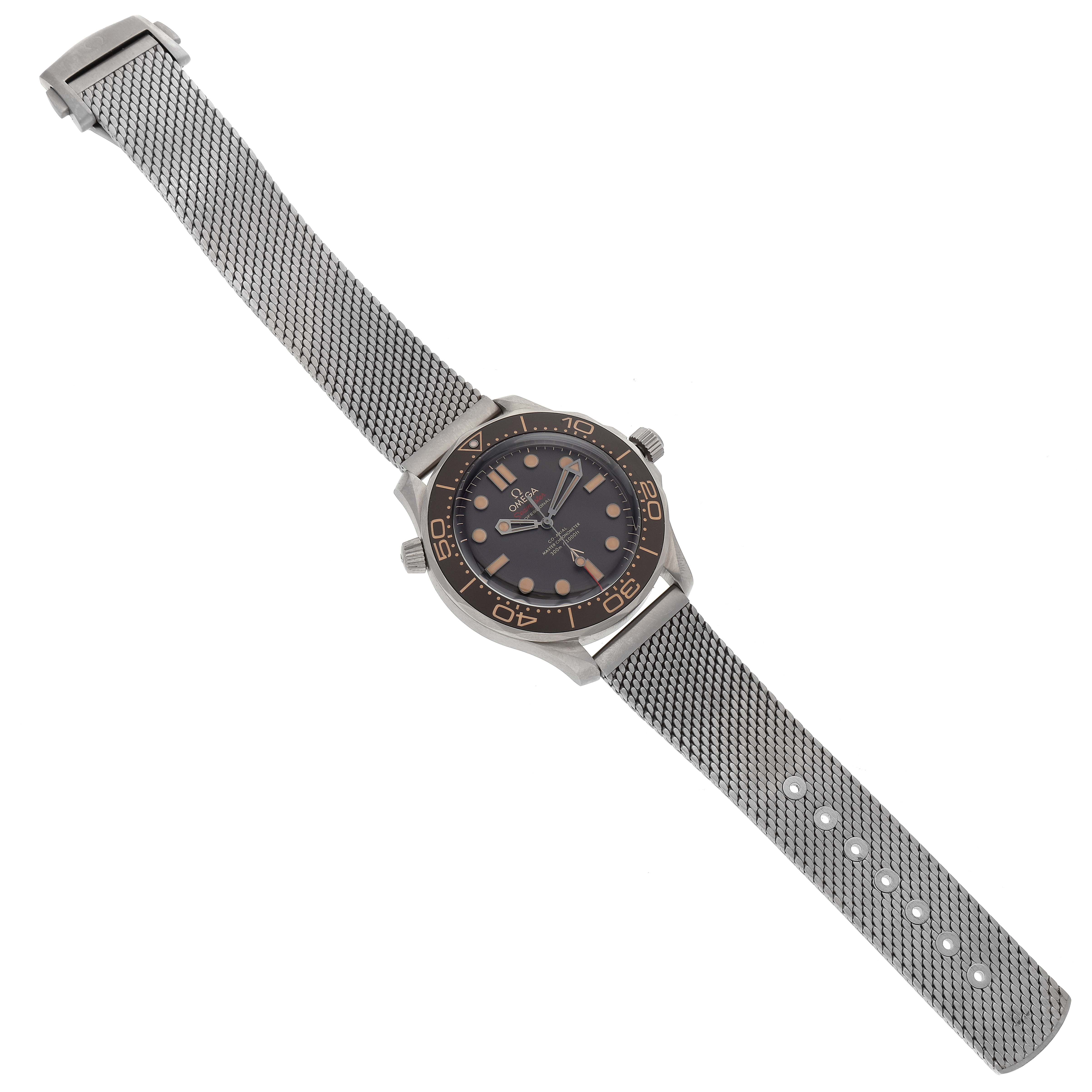 The image shows a full view of an Omega Seamaster 210.90.42.20.01.001 Men's Titanium Brown Dial 210.90.42.20.01.001 Men's Titanium Brown Dial watch, displaying its face, bezel, and mesh strap from an overhead angle.