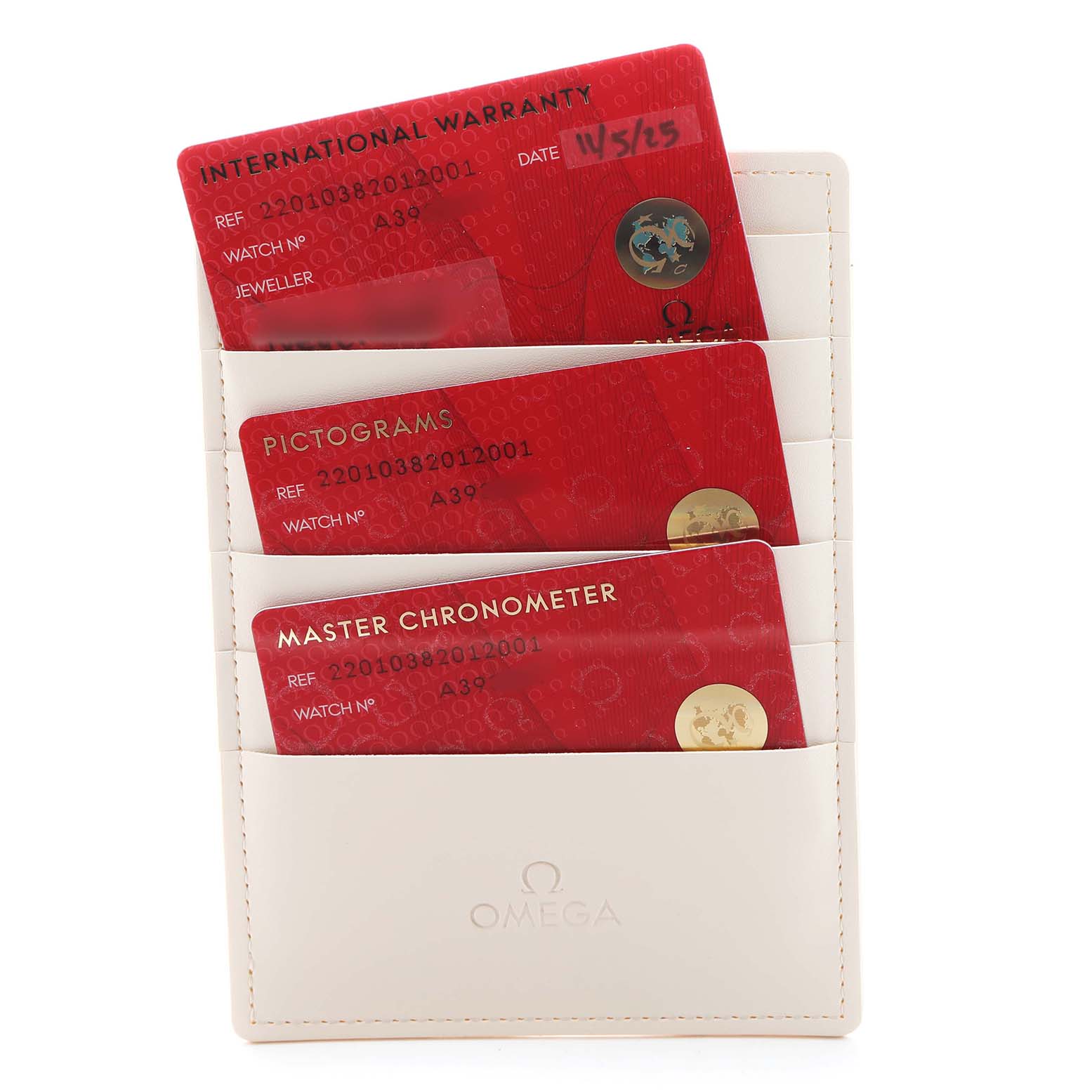 The image shows three red cards labeled "International Warranty," "Pictograms," and "Master Chronometer" in an Omega cardholder for the Aqua Terra model.