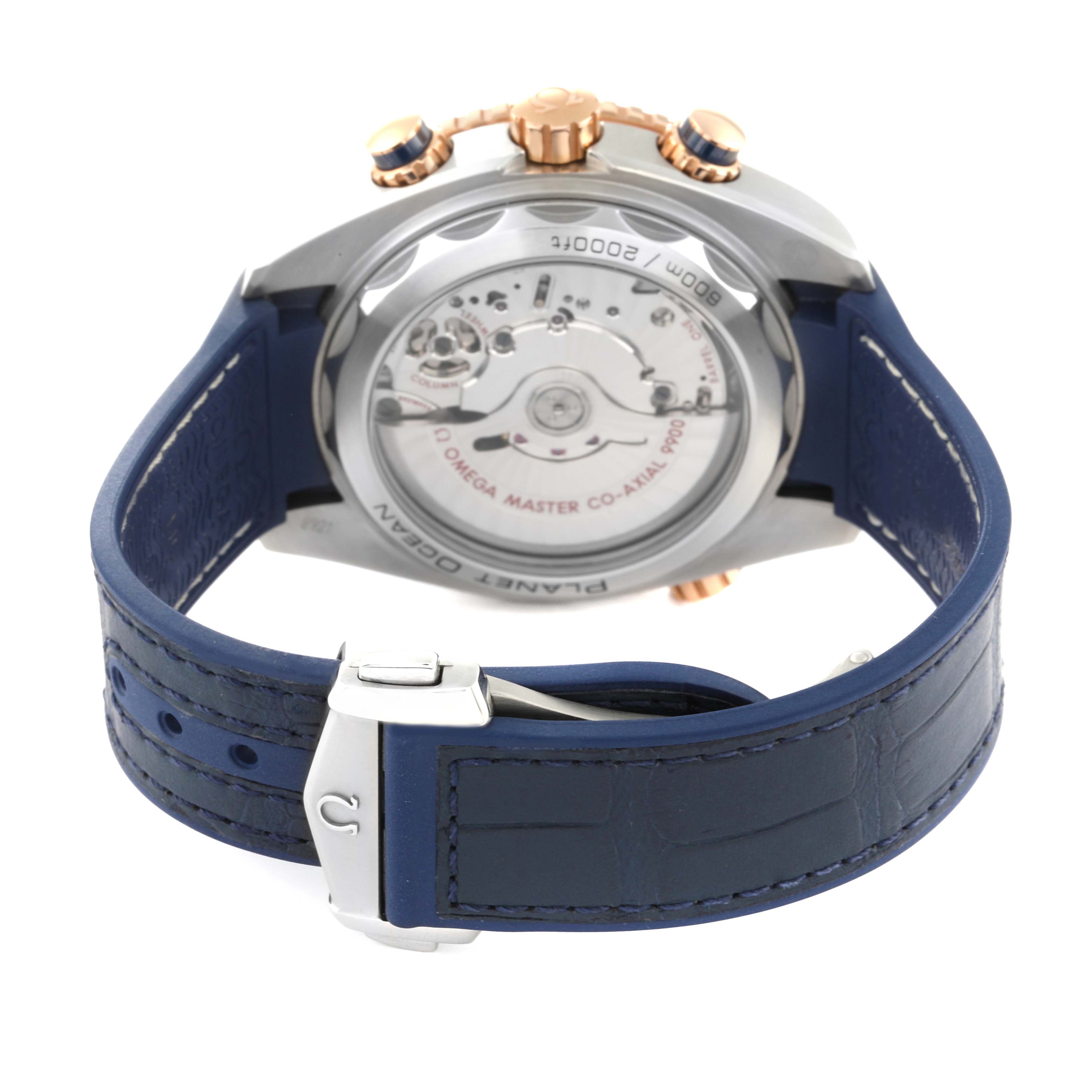 The image shows the back view of an Omega Planet Ocean 215.23.46.51.03.001 Men's Steel and Gold (two tone) Blue Dial 215.23.46.51.03.001 Men's Steel and Gold (two tone) Blue Dial watch, highlighting the movement and blue strap.