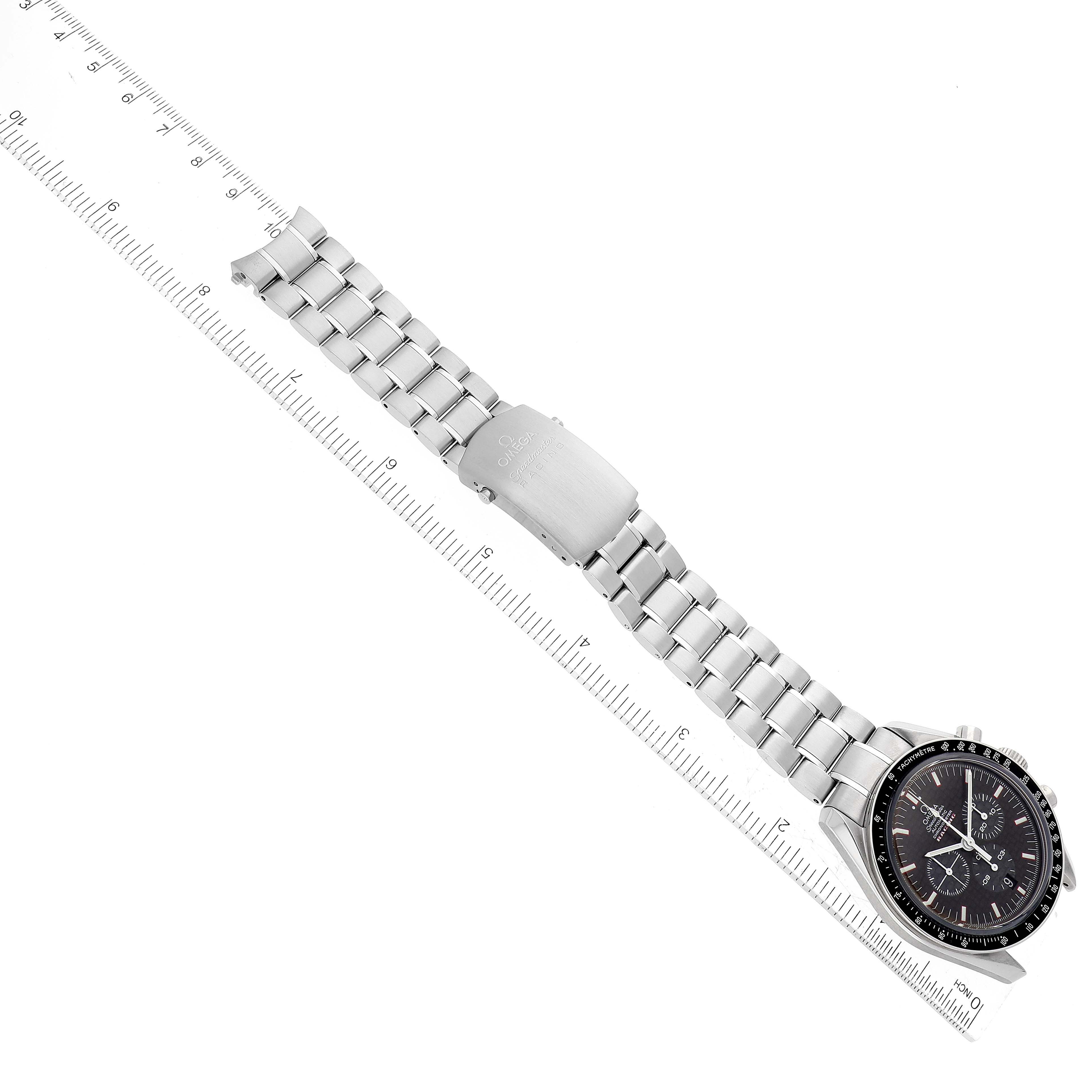 The image shows an Omega Speedmaster 3552.59.00 Men's Stainless Steel Black Dial 3552.59.00 Men's Stainless Steel Black Dial watch facing down, highlighting its face and metal bracelet with a deployed clasp.