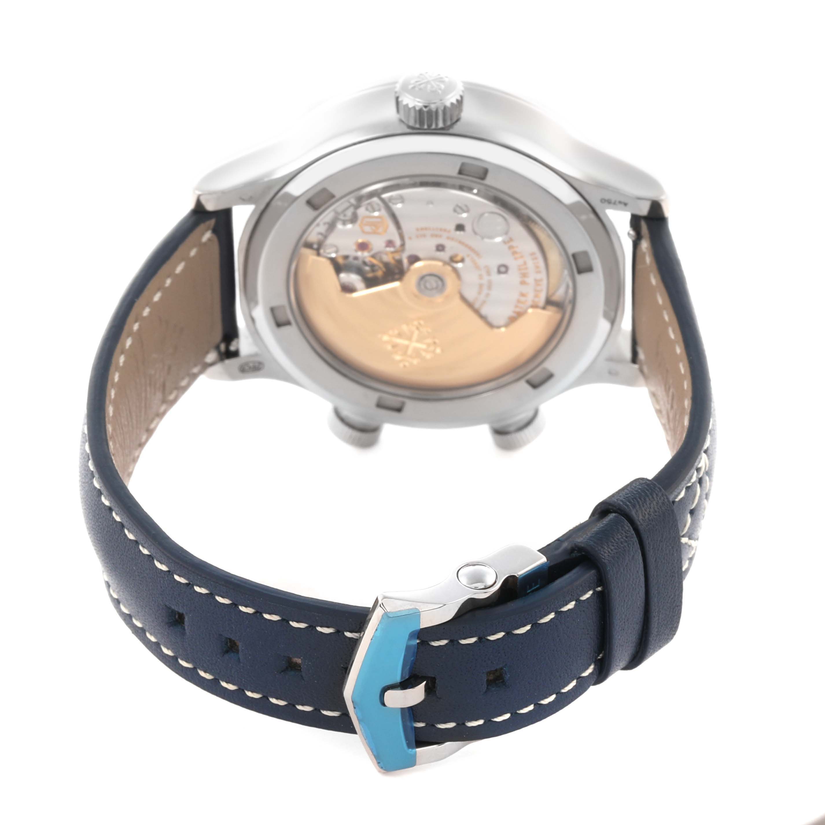 The image shows the back view of a Patek Philippe Calatrava 7234G-001 Men's White Gold Blue Dial 7234G-001 Men's White Gold Blue Dial watch with its movement visible and a blue leather strap.