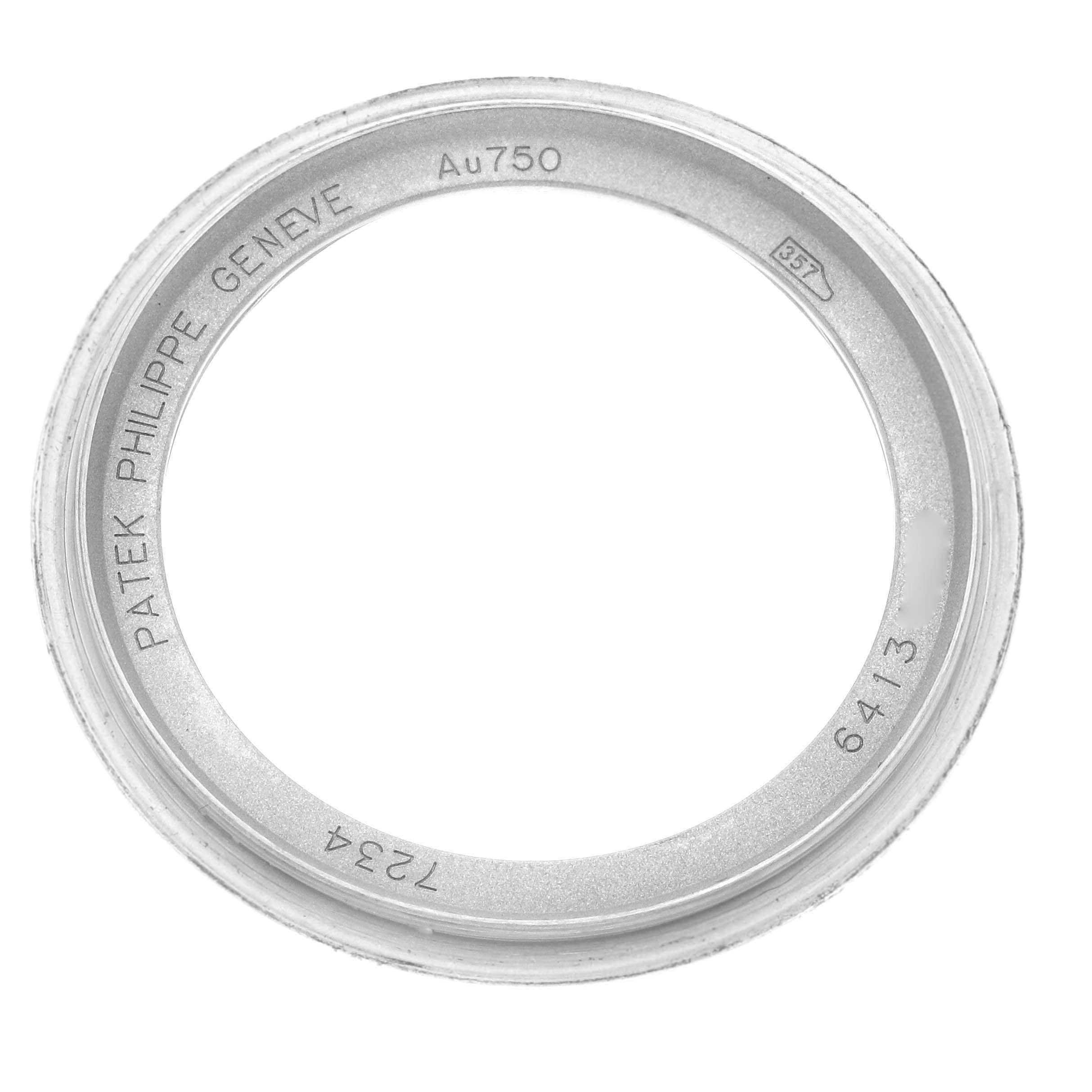 The image shows a top view of the Patek Philippe Calatrava 7234G-001 Men's White Gold Blue Dial 7234G-001 Men's White Gold Blue Dial watch bezel, highlighting engravings on its inner side.