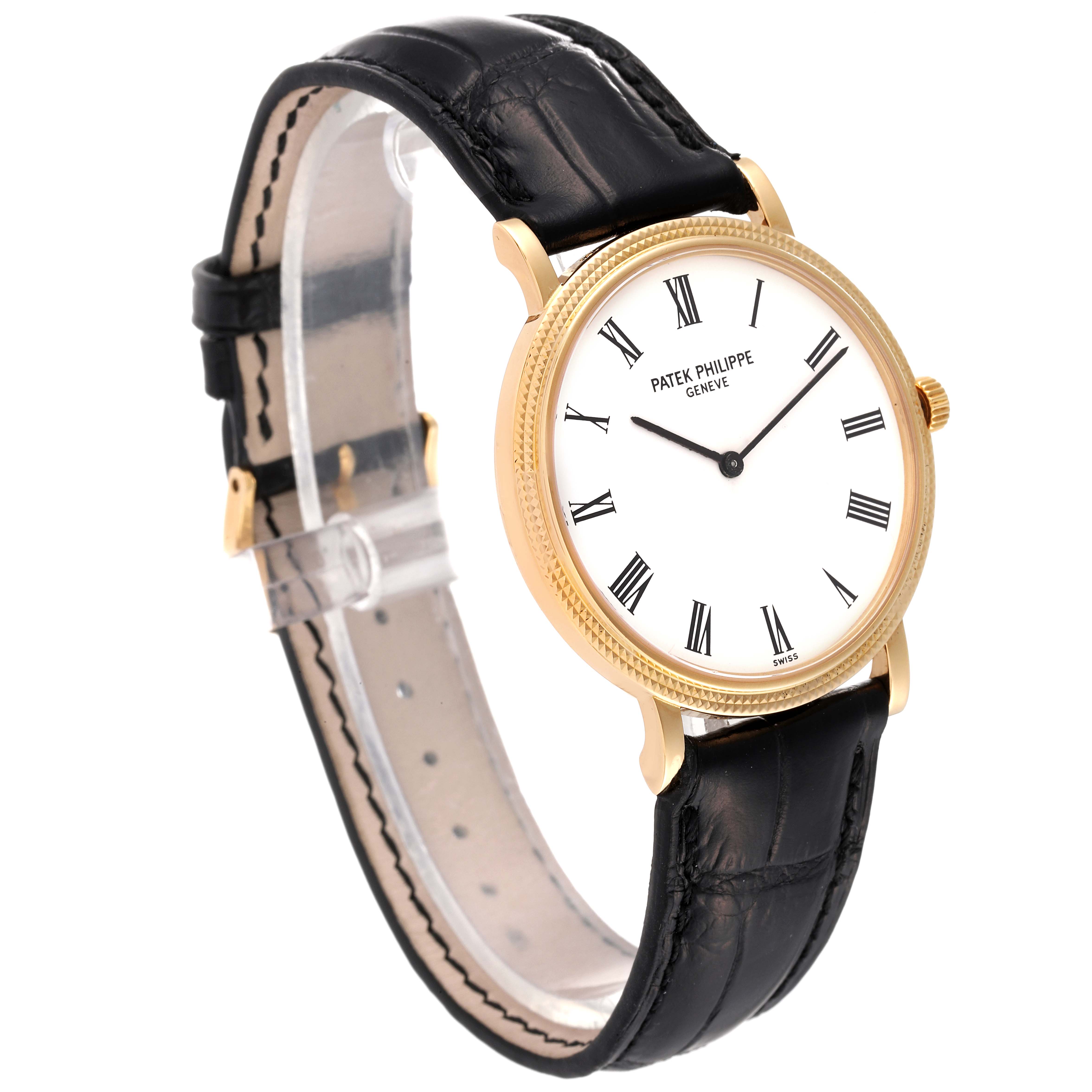 The image displays a Patek Philippe Calatrava 5120J Men's Yellow Gold White Dial 5120J Men's Yellow Gold White Dial watch at a three-quarter angle, showing the face, strap, and side profile.
