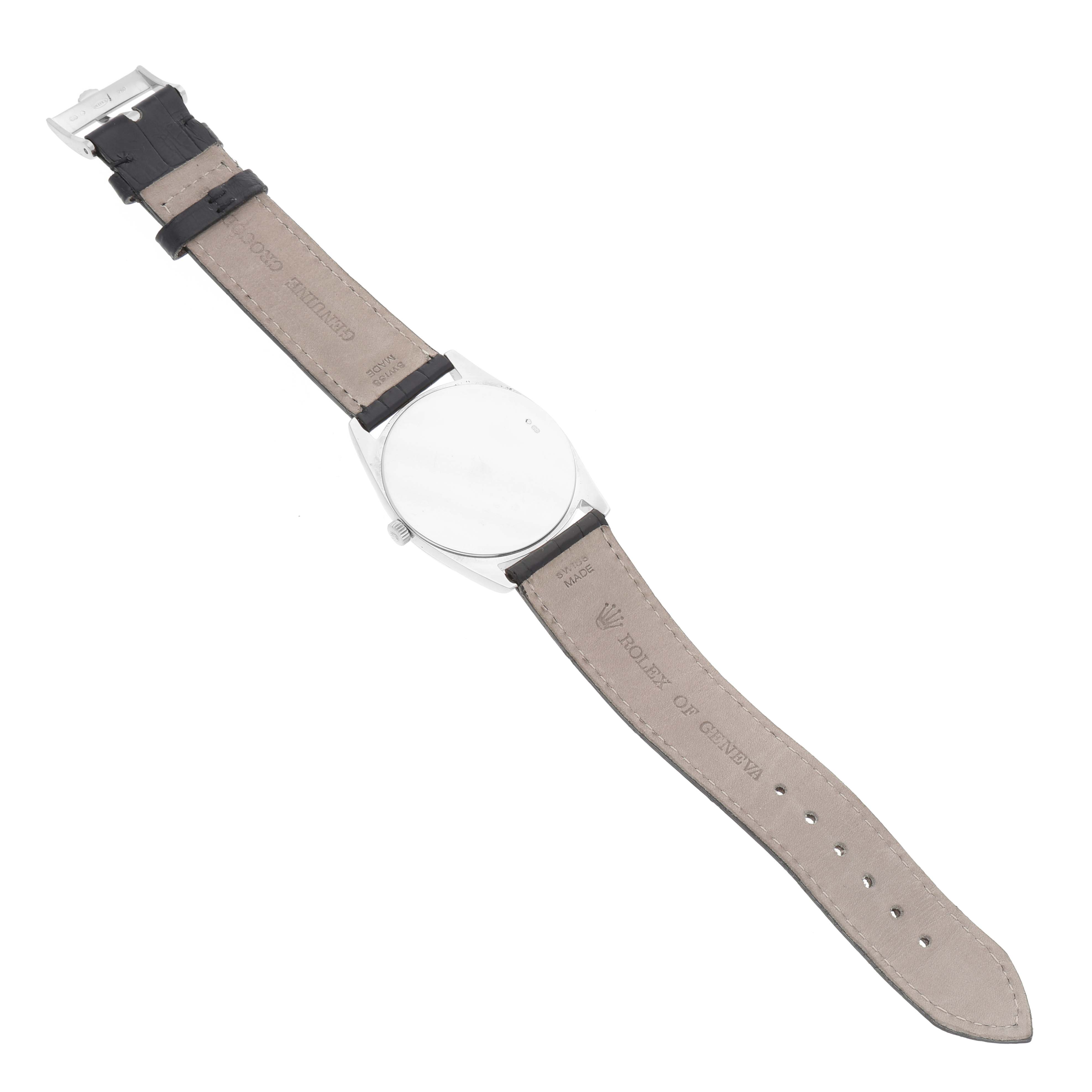 The image shows the back view of a Rolex Cellini 4233 Men's Rose Gold White Dial 4233 Men's Rose Gold White Dial watch, highlighting the leather strap and buckle.