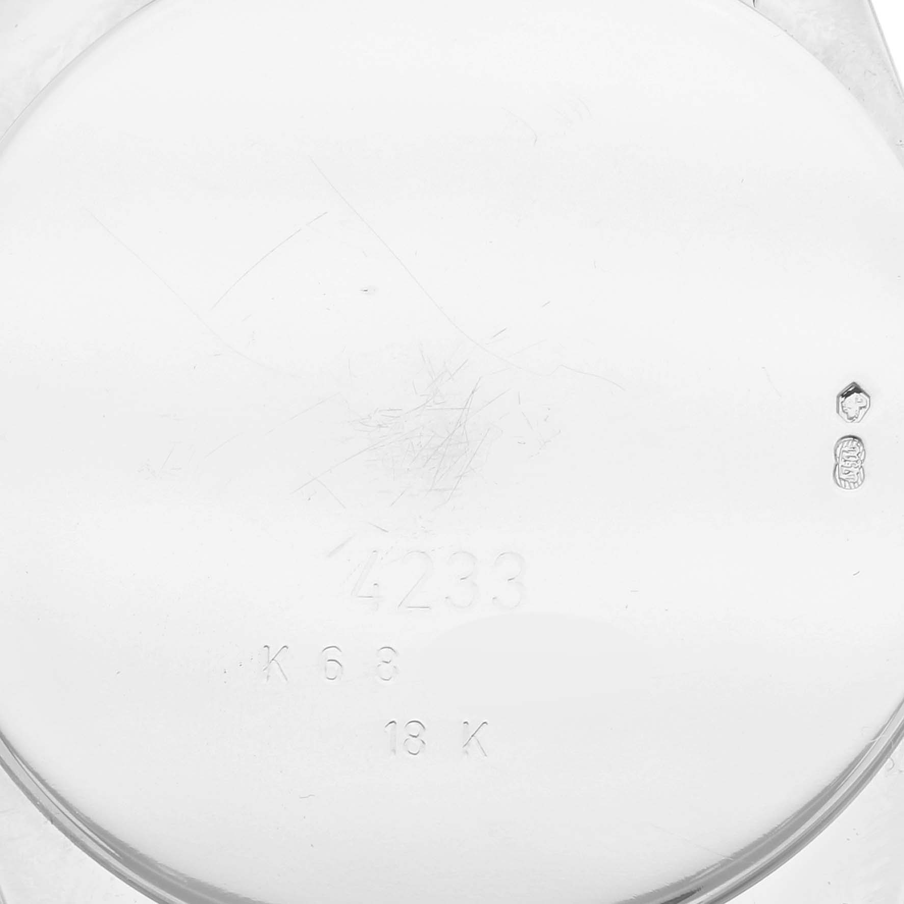 This image shows the back case of a Rolex Cellini 4233 Men's Rose Gold White Dial 4233 Men's Rose Gold White Dial watch, displaying its model number and gold hallmark.