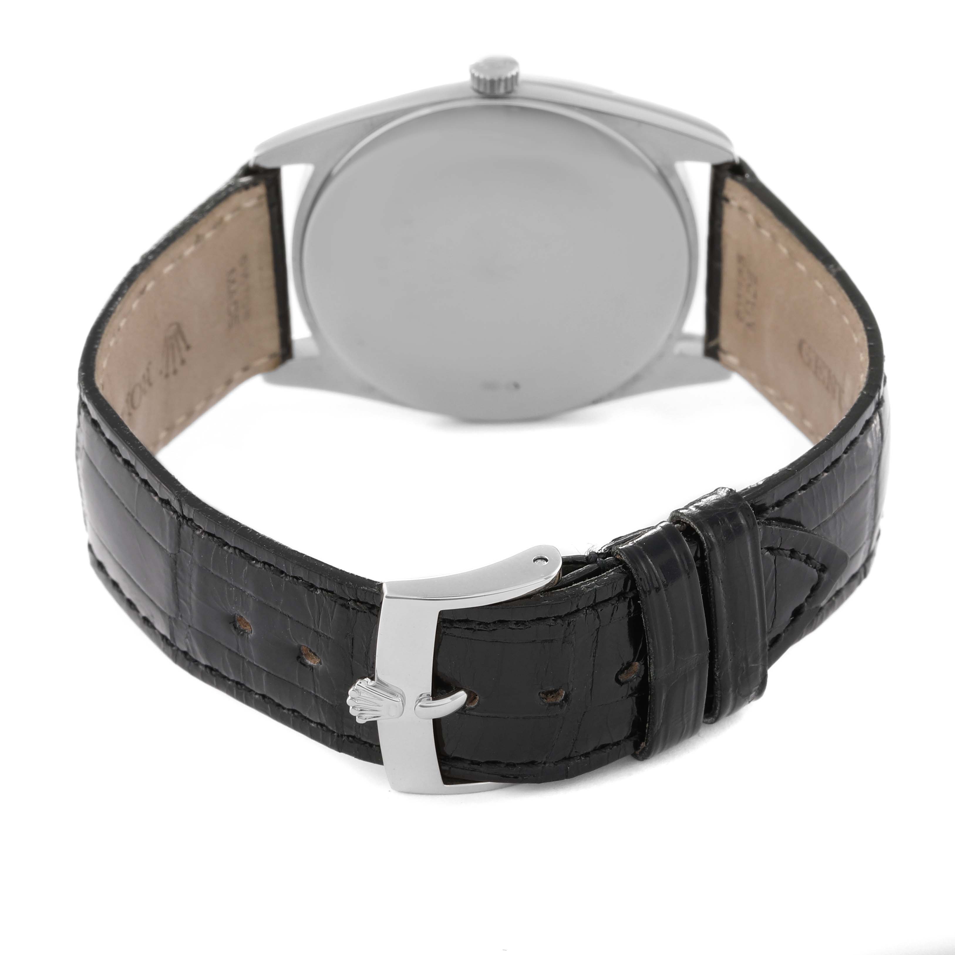 The image shows the backside of a Rolex Cellini 4233 Men's Rose Gold White Dial 4233 Men's Rose Gold White Dial model watch, displaying its leather strap and clasp.