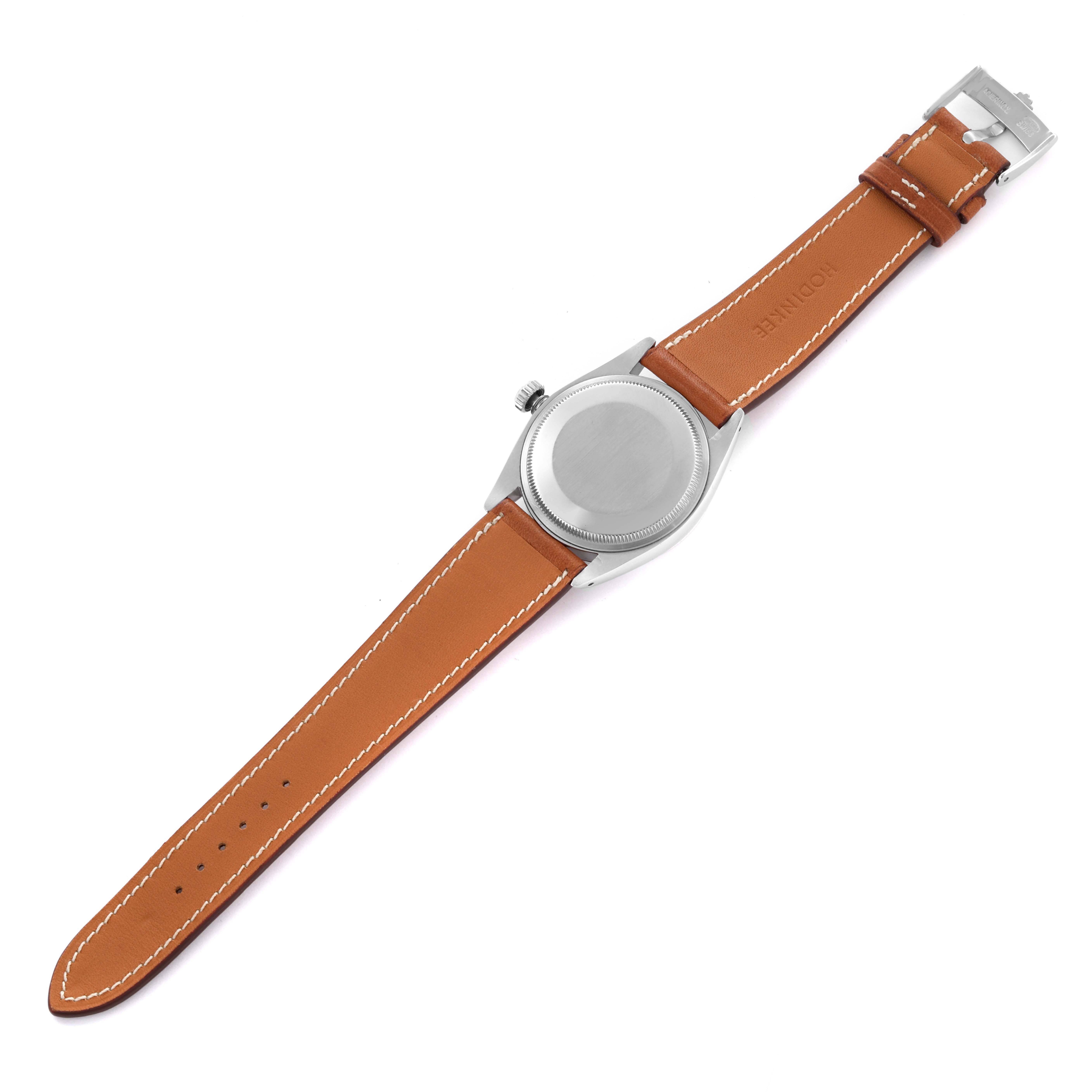 The image shows the back view of a Rolex Date 1500 Men's Stainless Steel Silver Dial 1500 Men's Stainless Steel Silver Dial model watch with a brown leather strap.