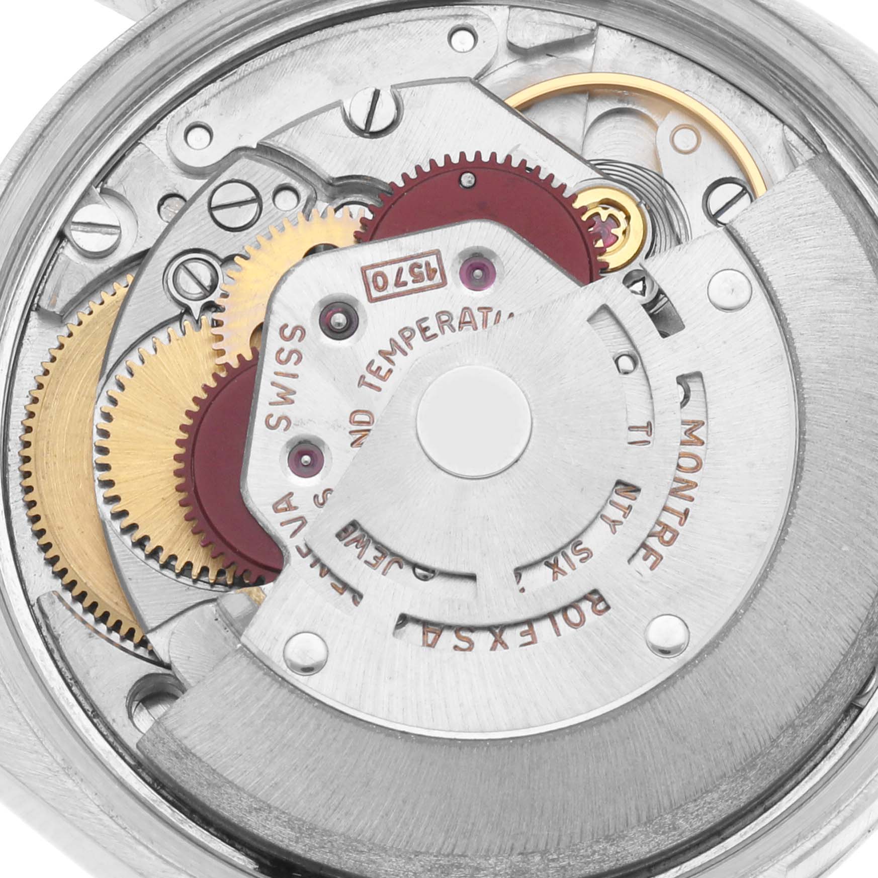 The image shows the intricate movement of a Rolex Date 1500 Men's Stainless Steel Silver Dial 1500 Men's Stainless Steel Silver Dial watch, focusing on gears and mechanisms from a top-down angle.