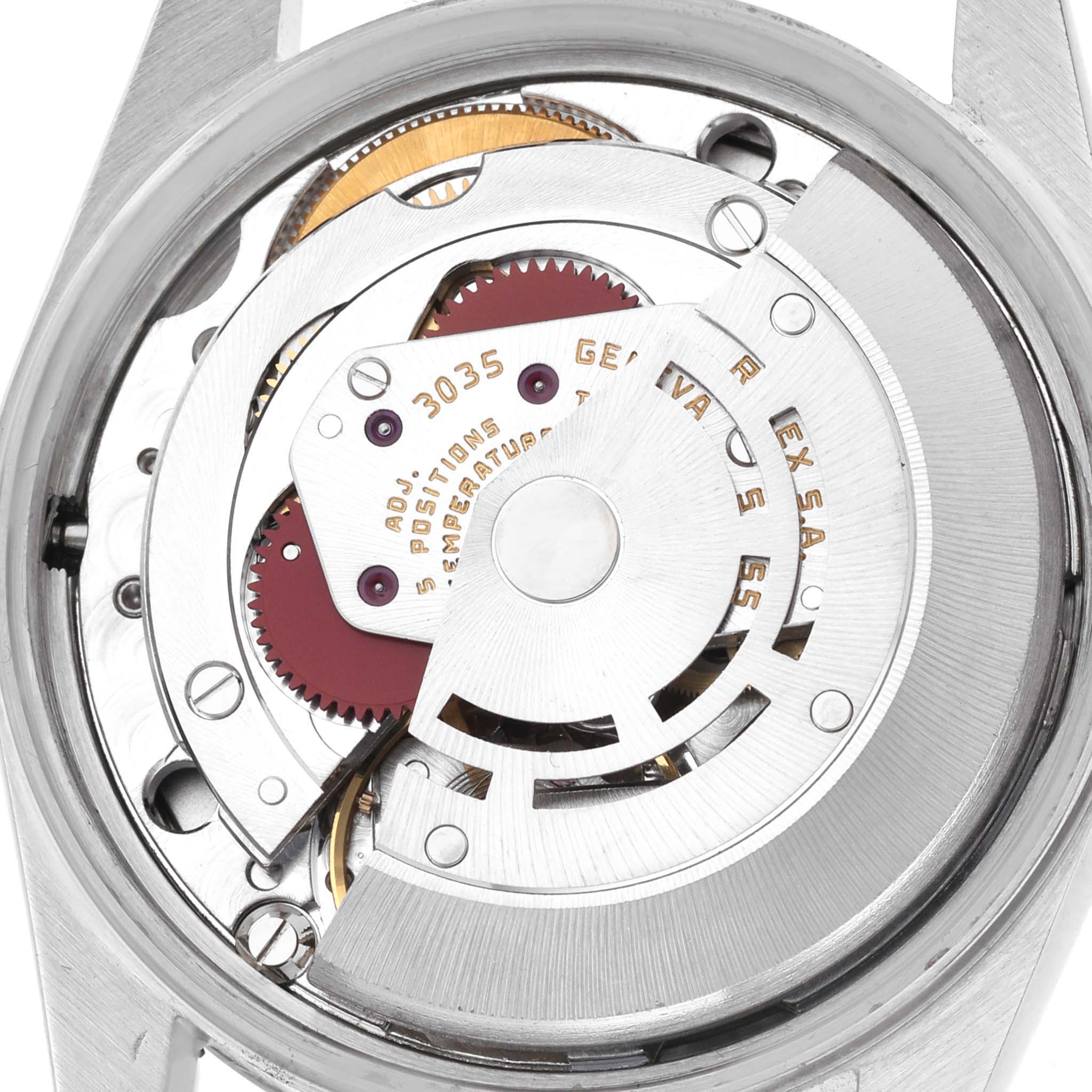 The image shows a close-up of the movement from the back of a Rolex Date 15000 Men
s Stainless Steel Silver Dial 15000 Men
s Stainless Steel Silver Dial watch, highlighting its intricate mechanism.