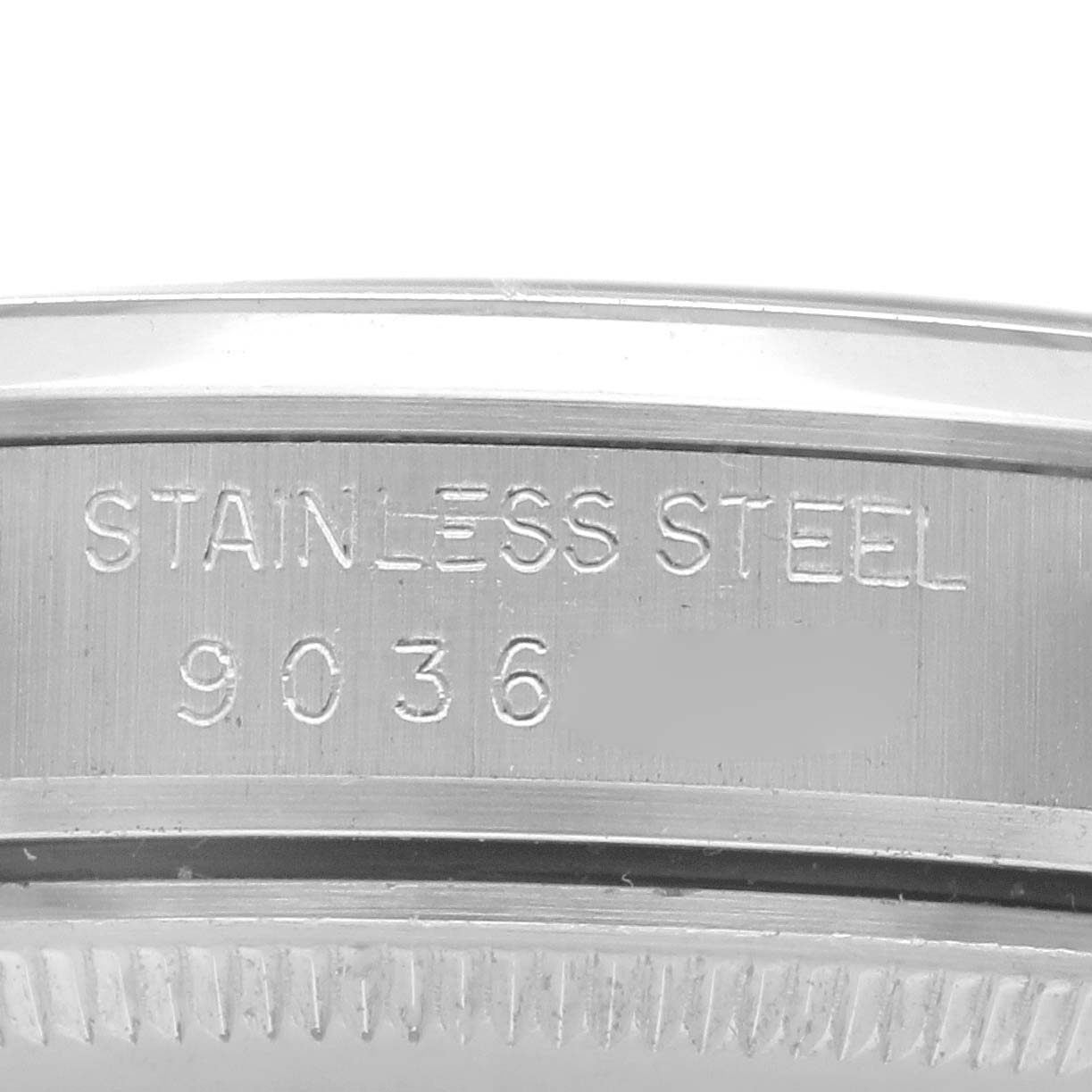 The image shows a close-up of the Rolex Date 15000 Men
s Stainless Steel Silver Dial 15000 Men
s Stainless Steel Silver Dial model
s stainless steel case side with its serial number.