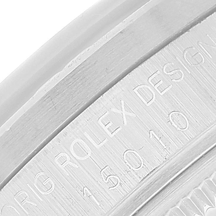 The image shows a close-up of the Vintage Collection Rolex watch's engraved case back, displaying the model number and brand name.