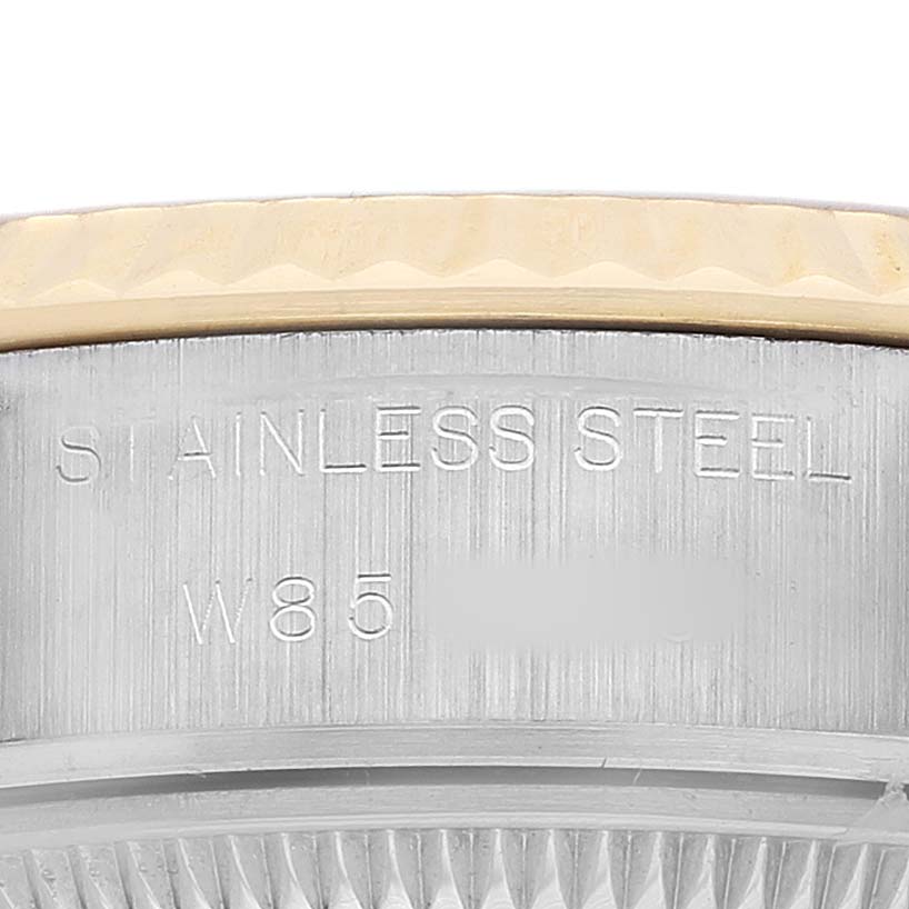 The image shows a close-up of the side of a Rolex Datejust 69173 Women's Steel and Gold (two tone) Champagne Dial, highlighting the stainless steel and part of the bezel.