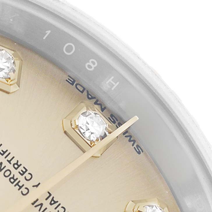 The image shows a close-up of the Rolex Datejust 279173 Women's Steel and Gold (two tone) Champagne Dial watch face, highlighting diamond markers, hands, and the "SWISS MADE" text.