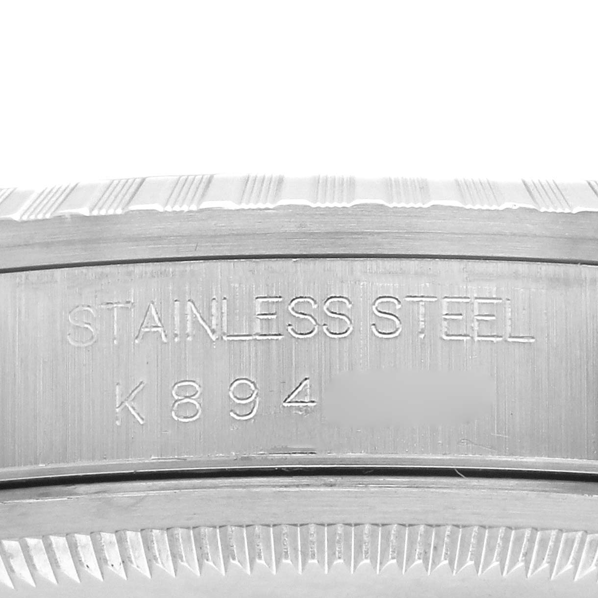 The image shows a close-up of the bezel and inner case of the Rolex Datejust 16220 Men's Stainless Steel Blue Dial 16220 Men's Stainless Steel Blue Dial, highlighting the "STAINLESS STEEL" engraving.