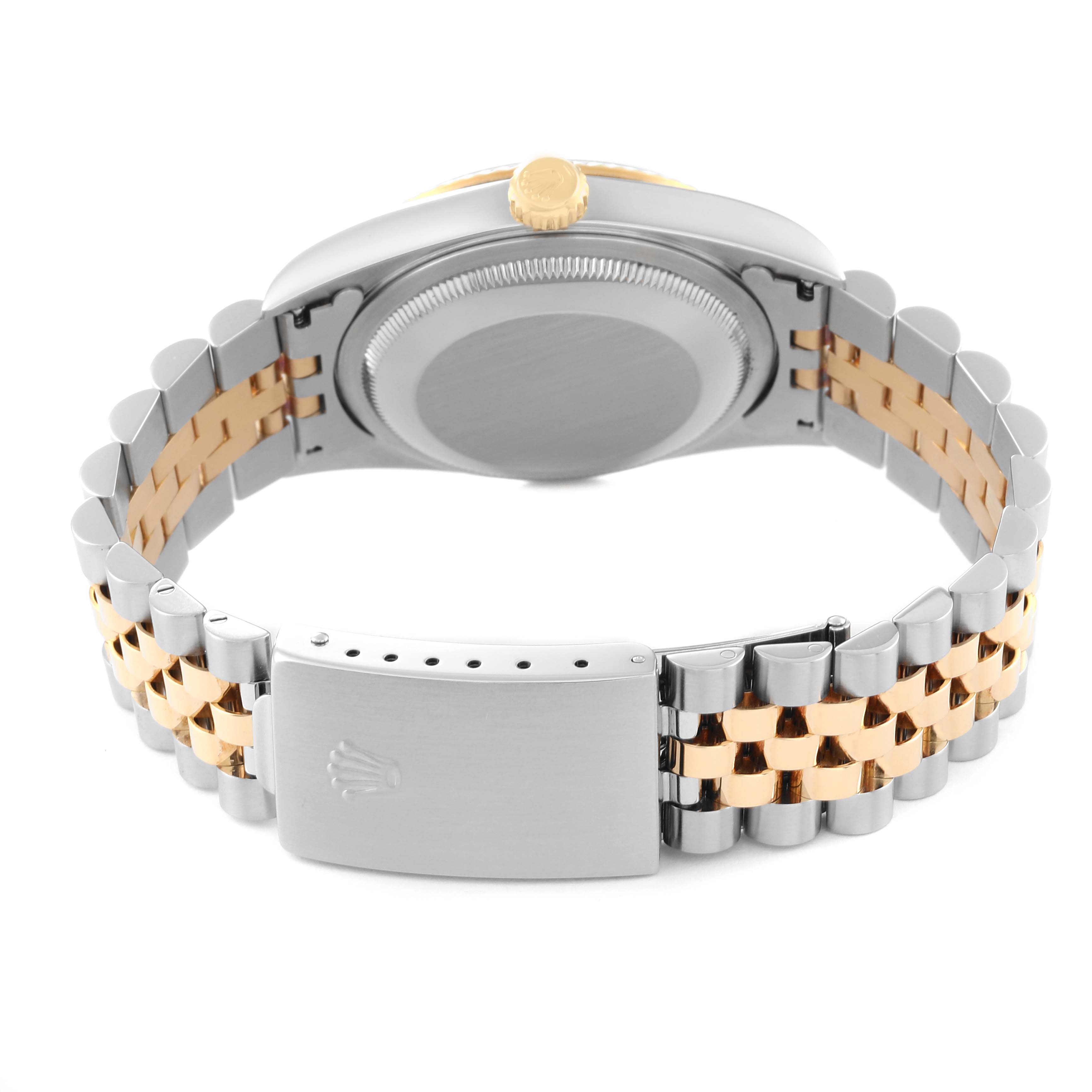 The Rolex Datejust 16233 Men's Steel and Gold (two tone) Black Dial 16233 Men's Steel and Gold (two tone) Black Dial watch is shown from the back, displaying its case, crown, and two-tone bracelet with the clasp.