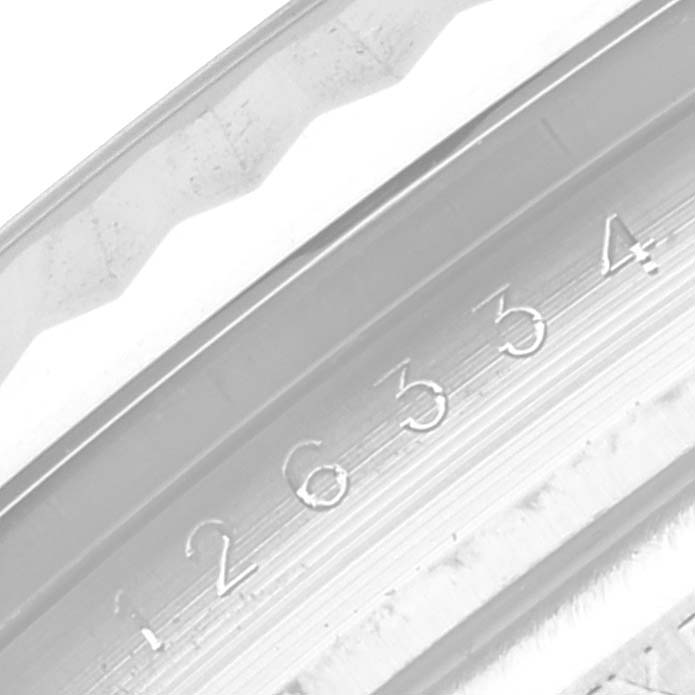 This image shows a close-up of the serial number engraving on the bezel and inner ring of a Rolex Datejust 41 126334 Men's Stainless Steel White Dial 126334 Men's Stainless Steel White Dial watch.
