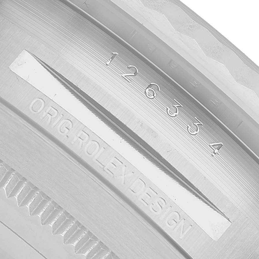 The image shows a close-up of the inner rim of a Rolex Datejust 41 126334 Men's Stainless Steel Grey Dial, featuring the model number engraving.