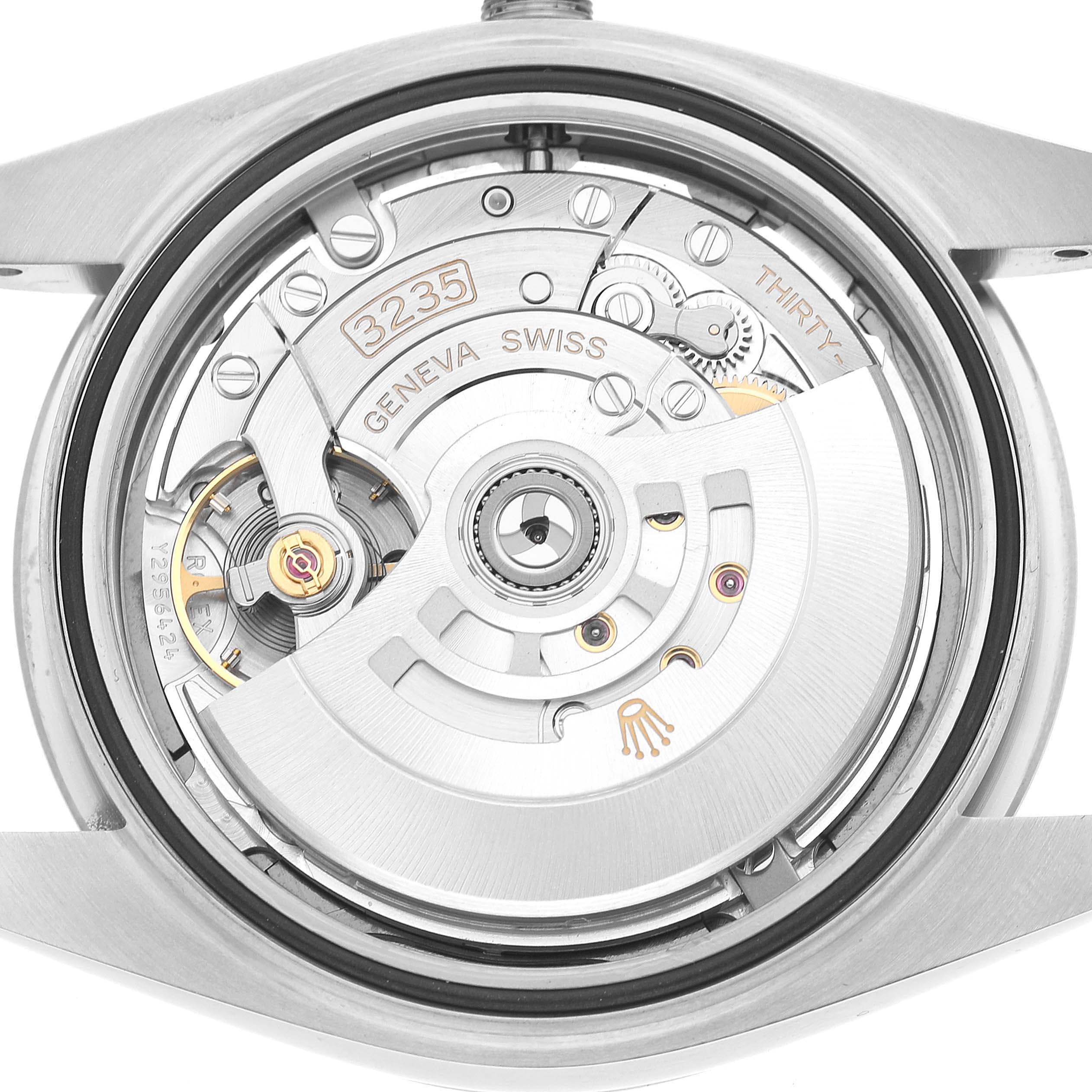 The image shows the back view of a Rolex Datejust 41 126334 Men's Stainless Steel Grey Dial, highlighting its internal movement and components.