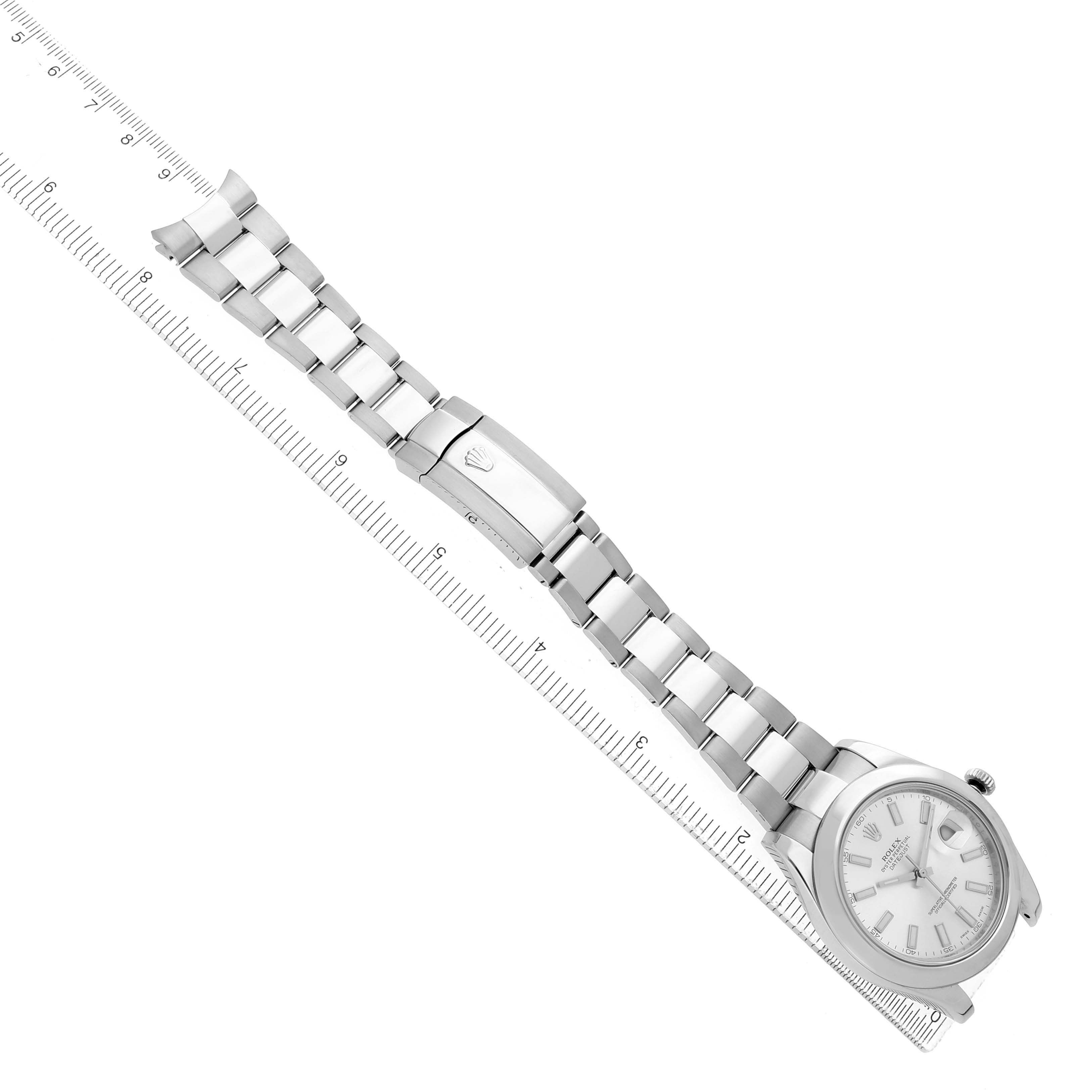 The Rolex Datejust 41 116300 Men's Stainless Steel Silver Dial is shown diagonally from above, displaying the face, bracelet, and clasp alongside a ruler.