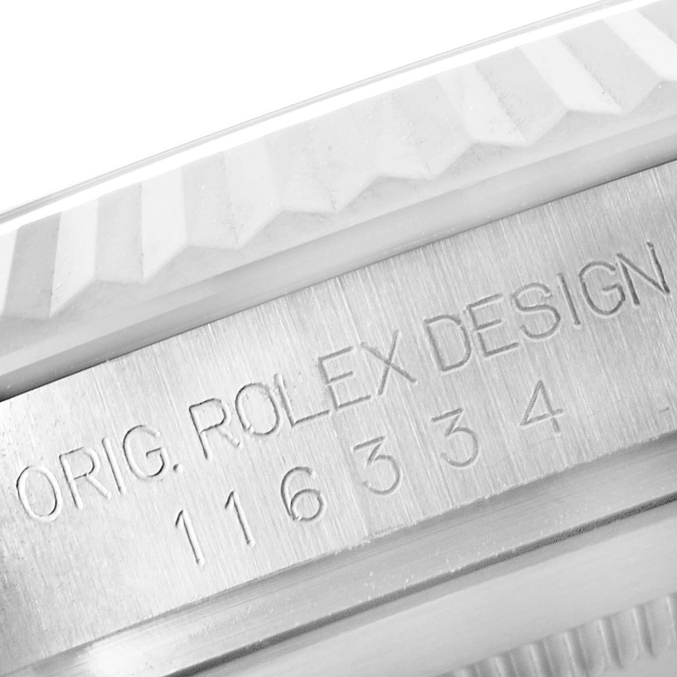 The image shows a close-up of the Rolex Datejust 41 116334 Men's Stainless Steel Black Dial model's fluted bezel and engraved case edge from a side angle.