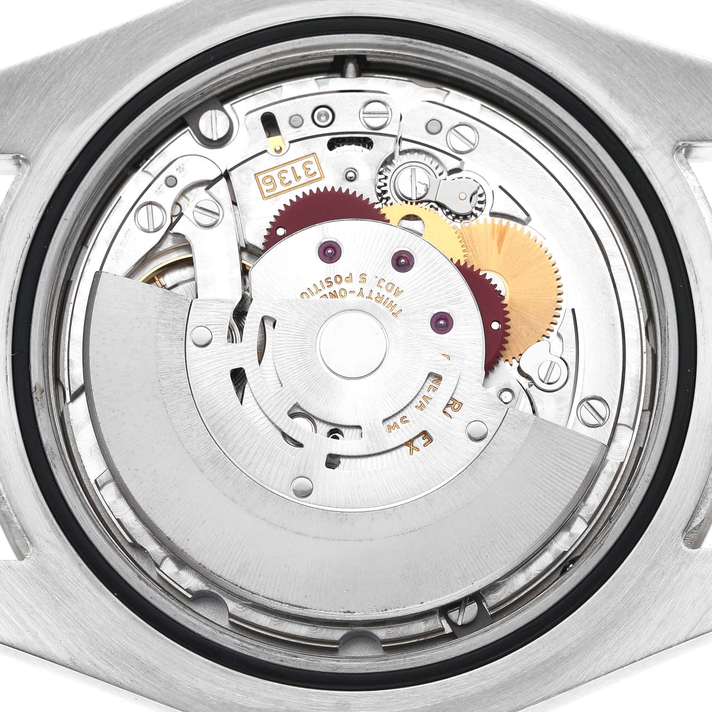 This image shows the back view of a Rolex Datejust 41 116334 Men's Stainless Steel Black Dial, revealing its internal mechanical movement and rotor.