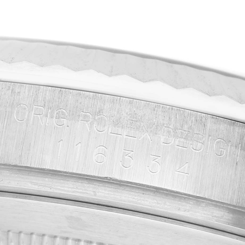 The image shows a close-up of the engraved side of a Rolex Datejust 41 116334 Men's Stainless Steel Silver Dial watch case, featuring the model number.