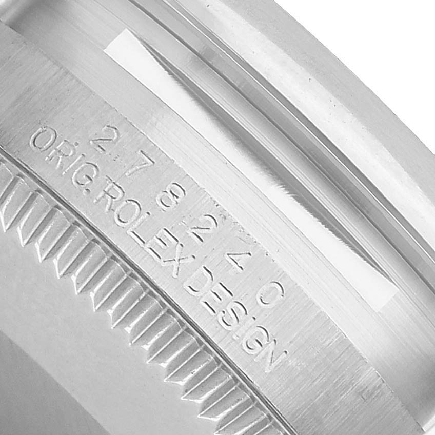 The image shows a close-up of the side casing and part of the bezel of a Rolex Datejust 278240 Women's Stainless Steel Grey Dial, highlighting the engraved serial number.