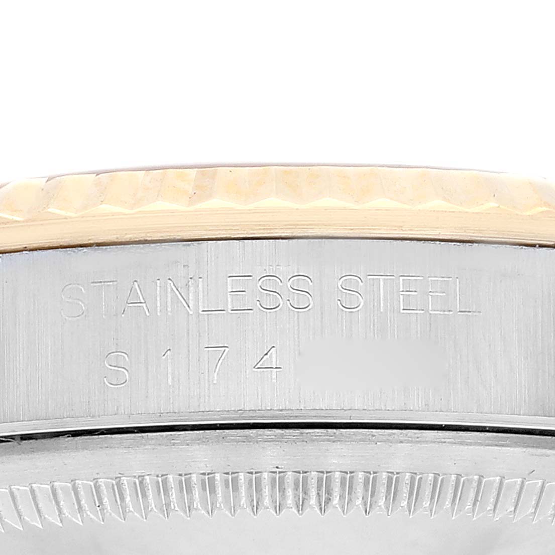 The image shows a close-up of the side and bezel of a stainless steel Rolex Datejust 16233 Men's Steel and Gold (two tone) Champagne Dial 16233 Men's Steel and Gold (two tone) Champagne Dial watch.