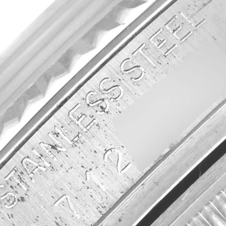 The image shows a close-up of the engraved edge of the bezel on a Rolex Datejust 16014 Men's Stainless Steel Silver Dial 16014 Men's Stainless Steel Silver Dial watch.