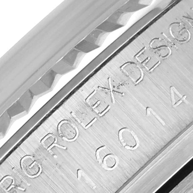 The image shows an angled close-up of the bezel and engraved model number of a Rolex Datejust 16014 Men's Stainless Steel Silver Dial 16014 Men's Stainless Steel Silver Dial.