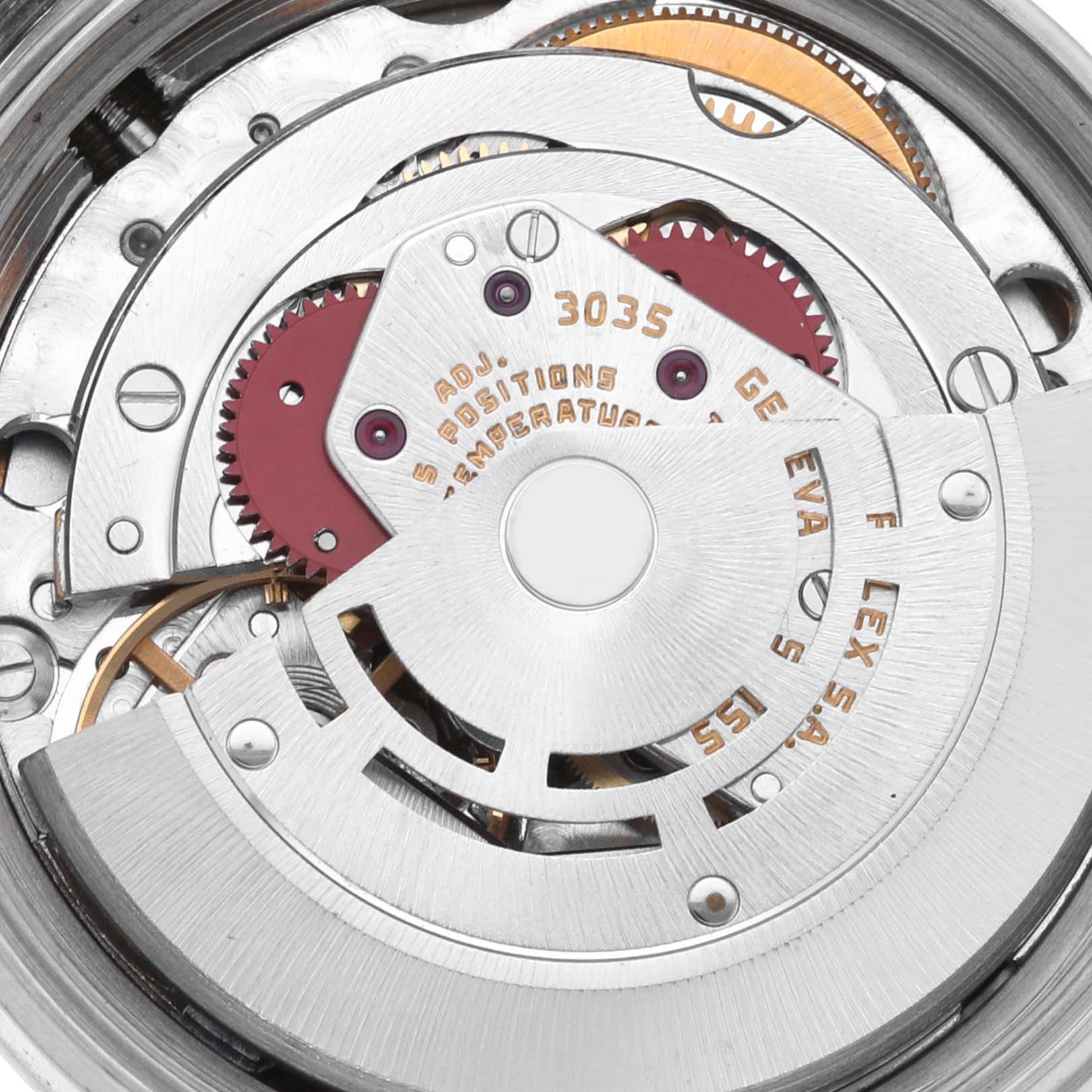 The image shows the Rolex Datejust 16014 Men's Stainless Steel Silver Dial 16014 Men's Stainless Steel Silver Dial movement from a top angle, highlighting gears and the rotor mechanism.