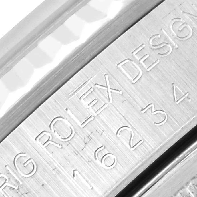 This close-up image shows the side engraving on a Rolex Datejust 16234 Men's Stainless Steel Silver Dial 16234 Men's Stainless Steel Silver Dial watch, focusing on the model and brand details.