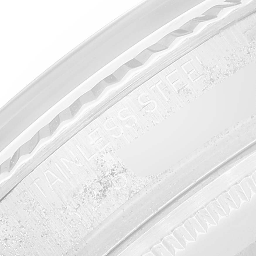 This close-up image of a Rolex Vintage Collection 1601 Men
s Stainless Steel Silver Dial 1601 Men
s Stainless Steel Silver Dial watch shows the engraved stainless steel bezel.