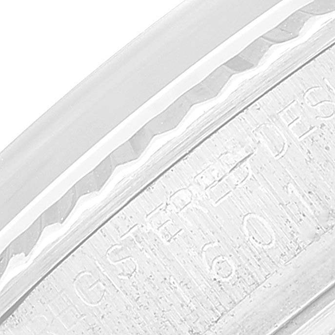 This close-up image shows part of the bezel and engraved side of the Rolex Vintage Collection 1601 Men
s Stainless Steel Silver Dial 1601 Men
s Stainless Steel Silver Dial watch.