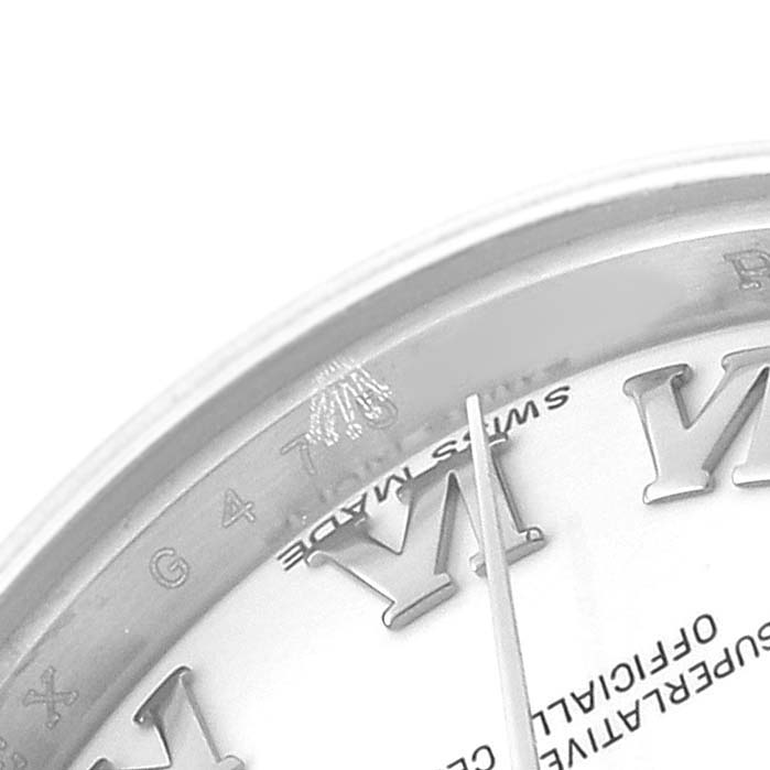 The image shows a partial close-up of the Rolex Datejust 179174 Women's Stainless Steel White Dial dial, highlighting the Roman numeral markers and part of the second hand.