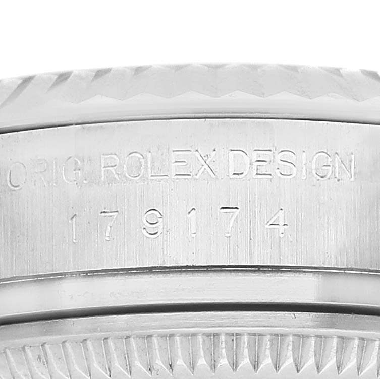 The image shows a close-up of the side engraving on a Rolex Datejust 179174 Women's Stainless Steel White Dial, highlighting "ORIG. ROLEX DESIGN" and the model number.