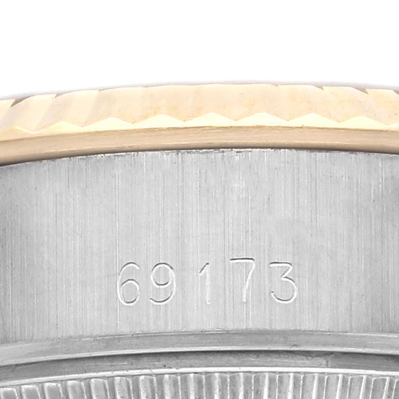 The image shows a close-up of the side of a Rolex Datejust 69173 Women's Steel and Gold (two tone) Champagne Dial 69173 Women's Steel and Gold (two tone) Champagne Dial watch, highlighting the model number engraved on the case.