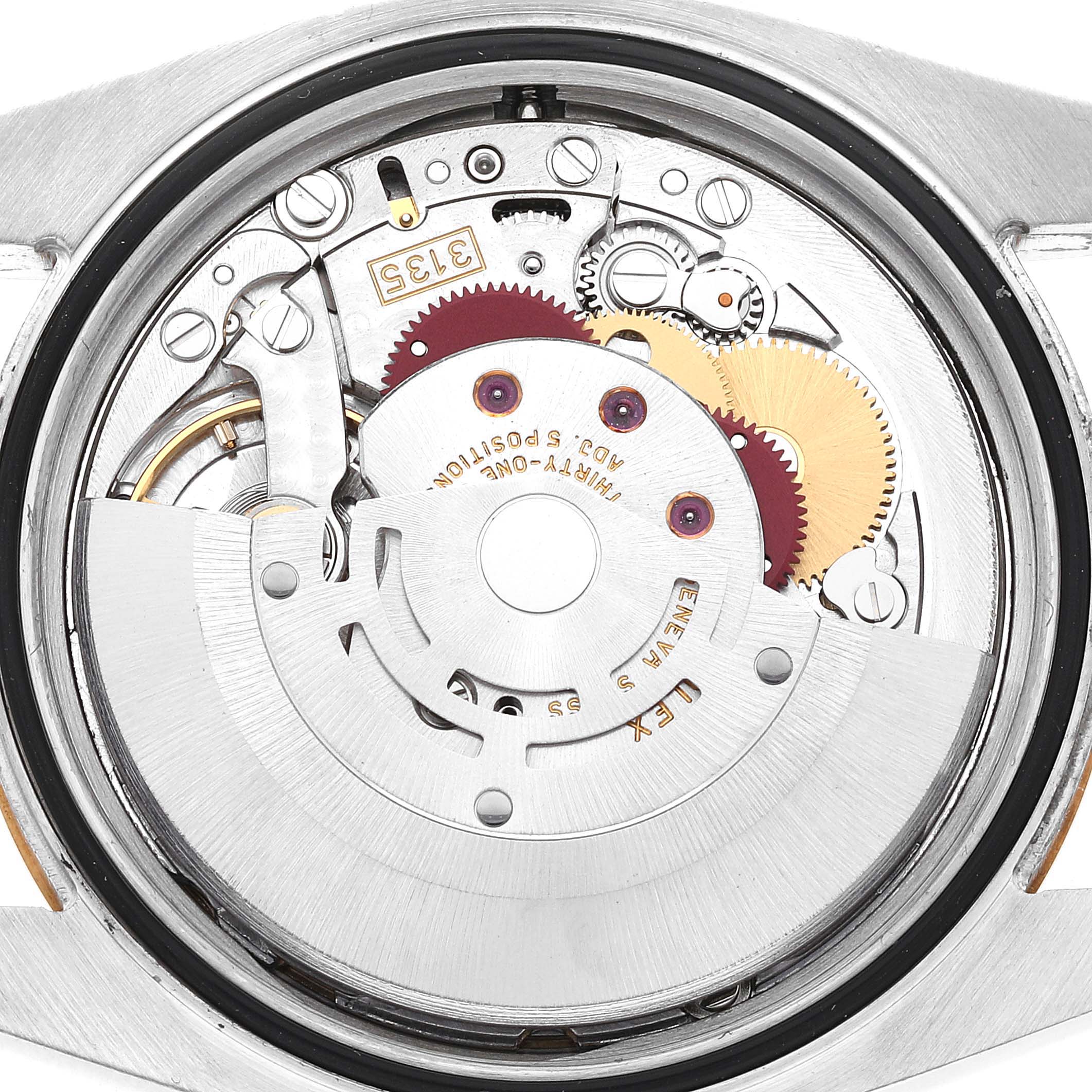 The image shows the internal movement of a Rolex Datejust 116233 Men's Steel and Gold (two tone) Champagne Dial 116233 Men's Steel and Gold (two tone) Champagne Dial watch from a close-up, rear angle.