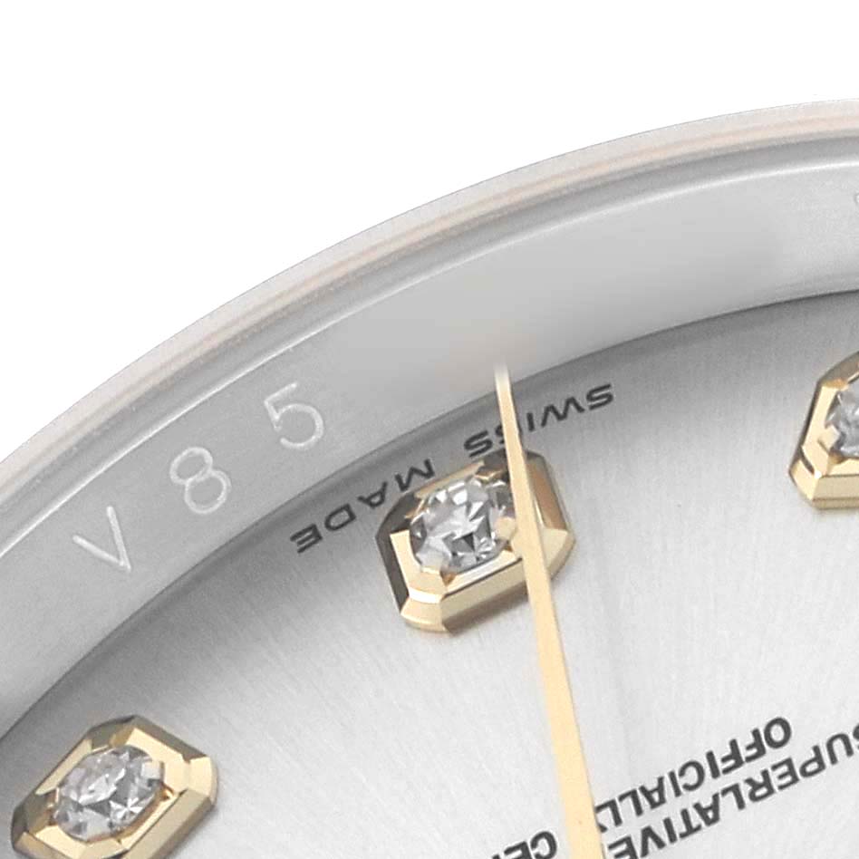 This close-up of the Rolex Datejust 116233 Men's Stainless Steel Silver Dial shows the dial edge, part of the bezel, diamond markers, and the "Swiss Made" text.