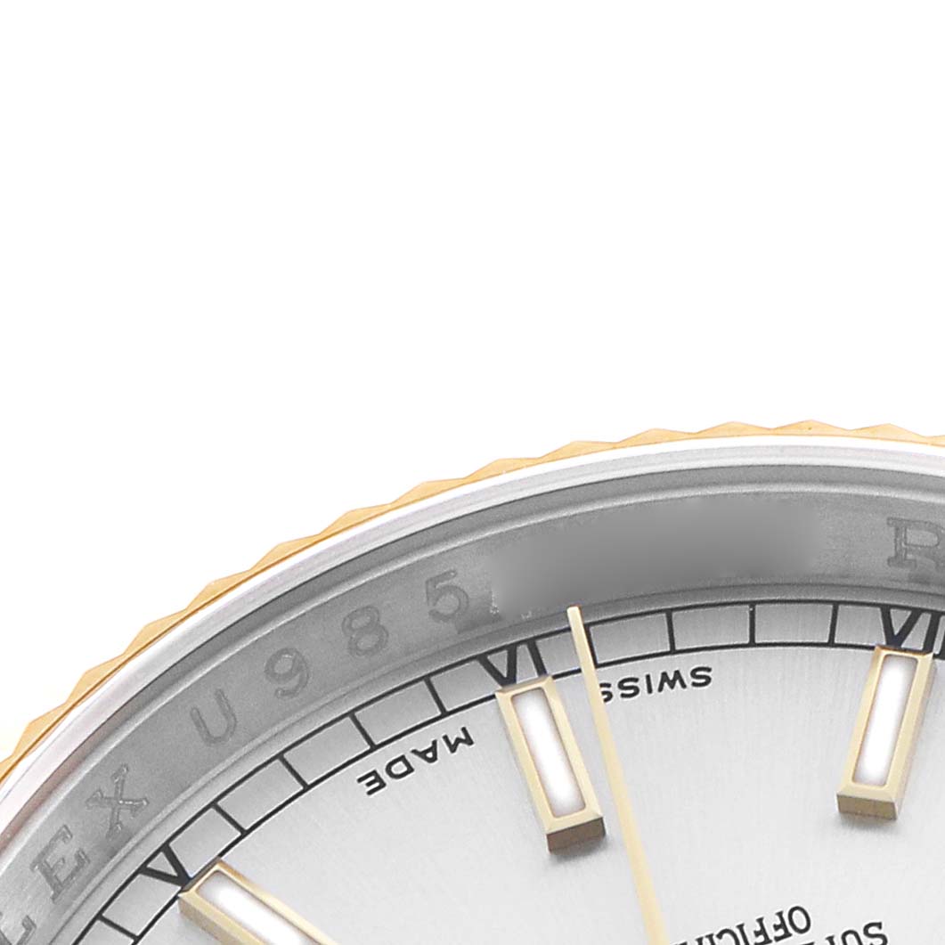 The image shows a close-up of the Rolex Datejust 116233 Men's Stainless Steel Silver Dial dial, highlighting the indices and partial branding.