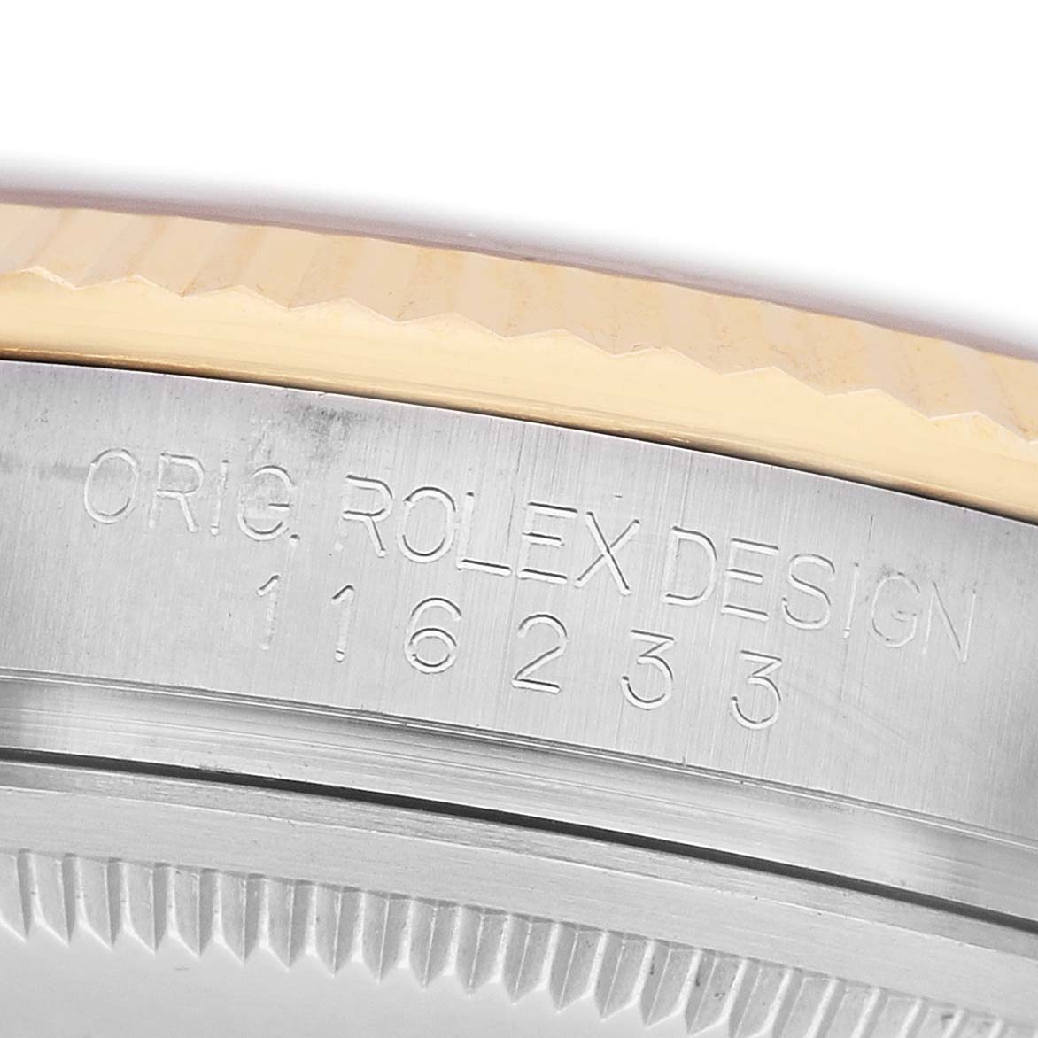 The image shows a close-up side view of the Rolex Datejust 116233 Men's Stainless Steel Silver Dial watch's fluted bezel with engraved model number.