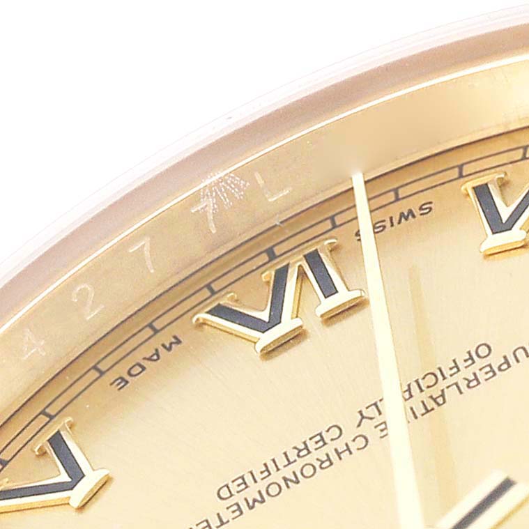 This close-up of the Rolex President 118238 Men
s Yellow Gold Champagne Dial 118238 Men
s Yellow Gold Champagne Dial watch shows part of the dial with Roman numeral hour markers, and the “Swiss Made” text.
