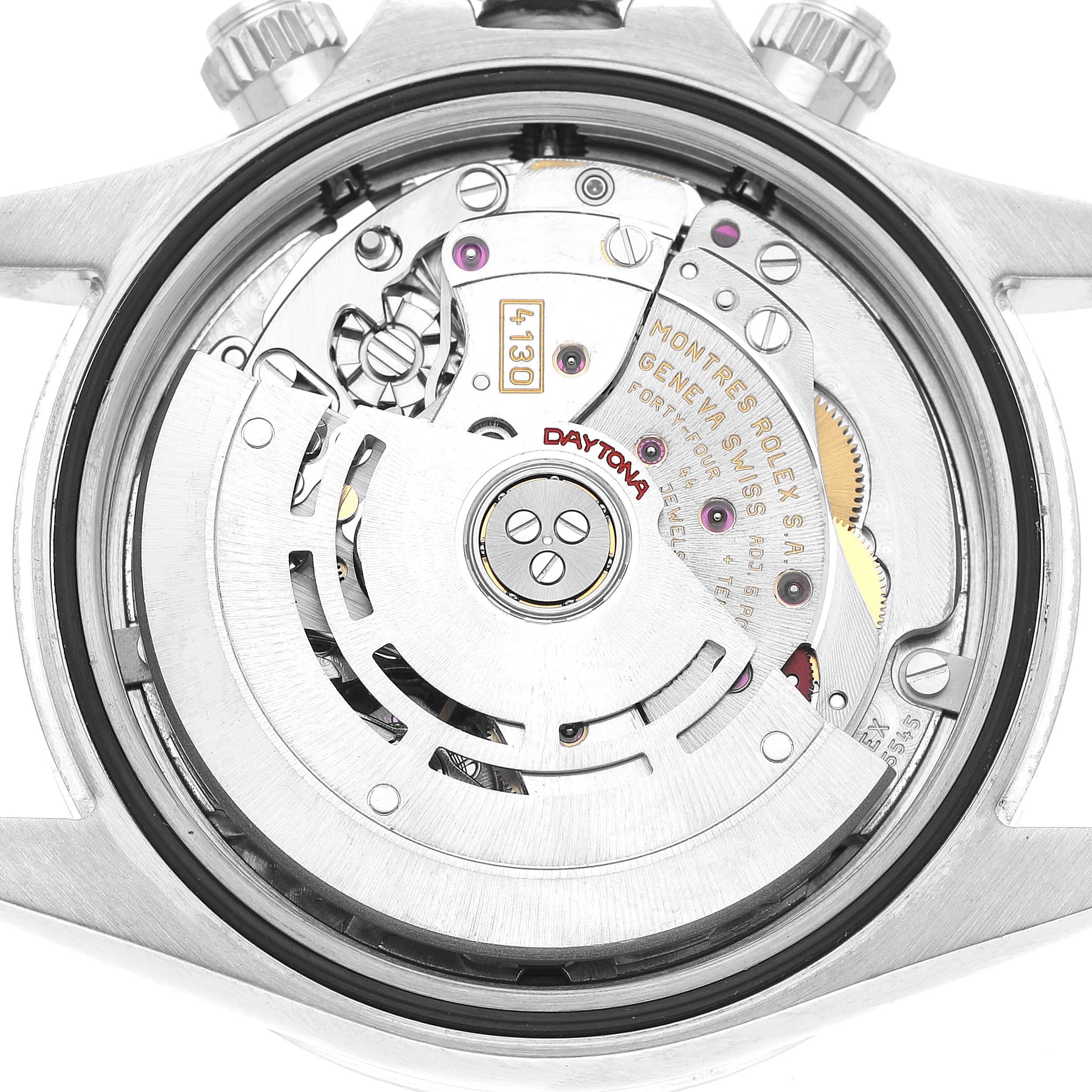 The image shows the movement of a Rolex Daytona 116520 Men's Stainless Steel Black Dial watch from the back, highlighting the rotor and intricate components.