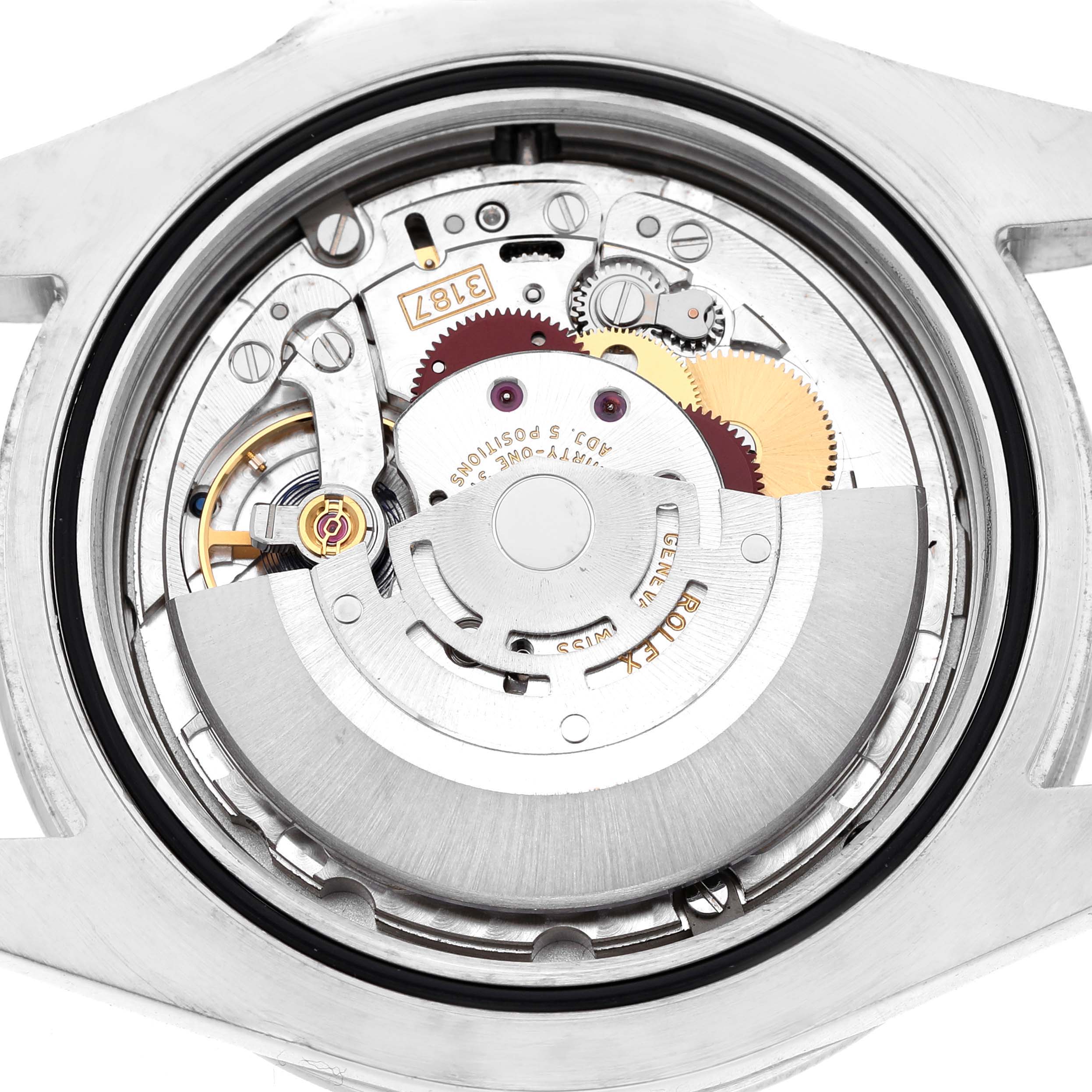 The image shows the internal mechanism of a Rolex Explorer 216570 Men's Stainless Steel Black Dial watch, viewed from the back, highlighting gears and the rotor.