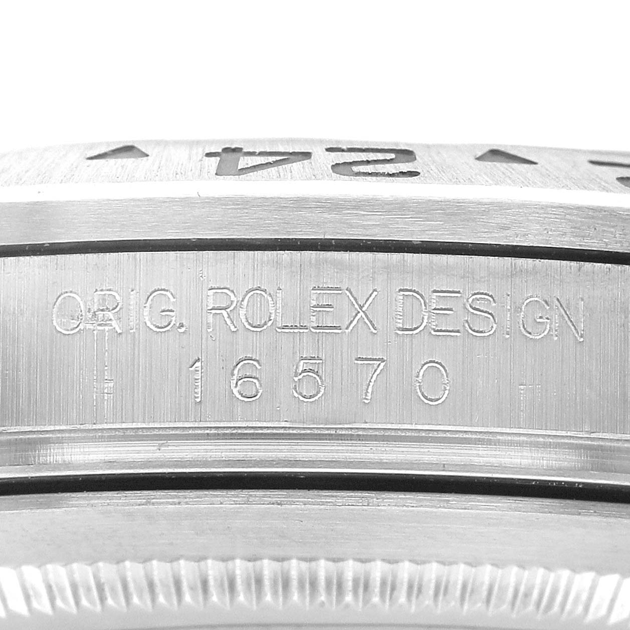 The image shows a close-up of the case side of a Rolex Explorer 16570 Men's Stainless Steel White Dial, highlighting the engraved model information.
