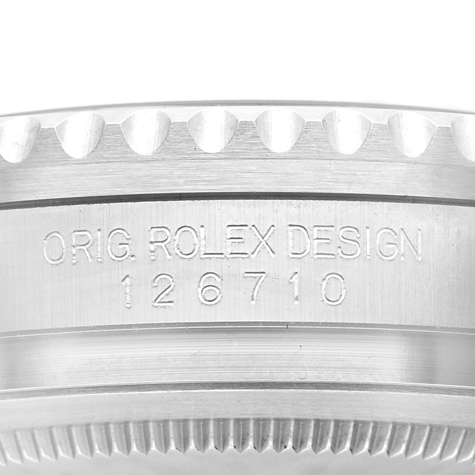 Close-up view of the engraved side of a Rolex GMT-Master 126710 Men's Stainless Steel Black Dial 126710 Men's Stainless Steel Black Dial watch case showing the model number 126710.