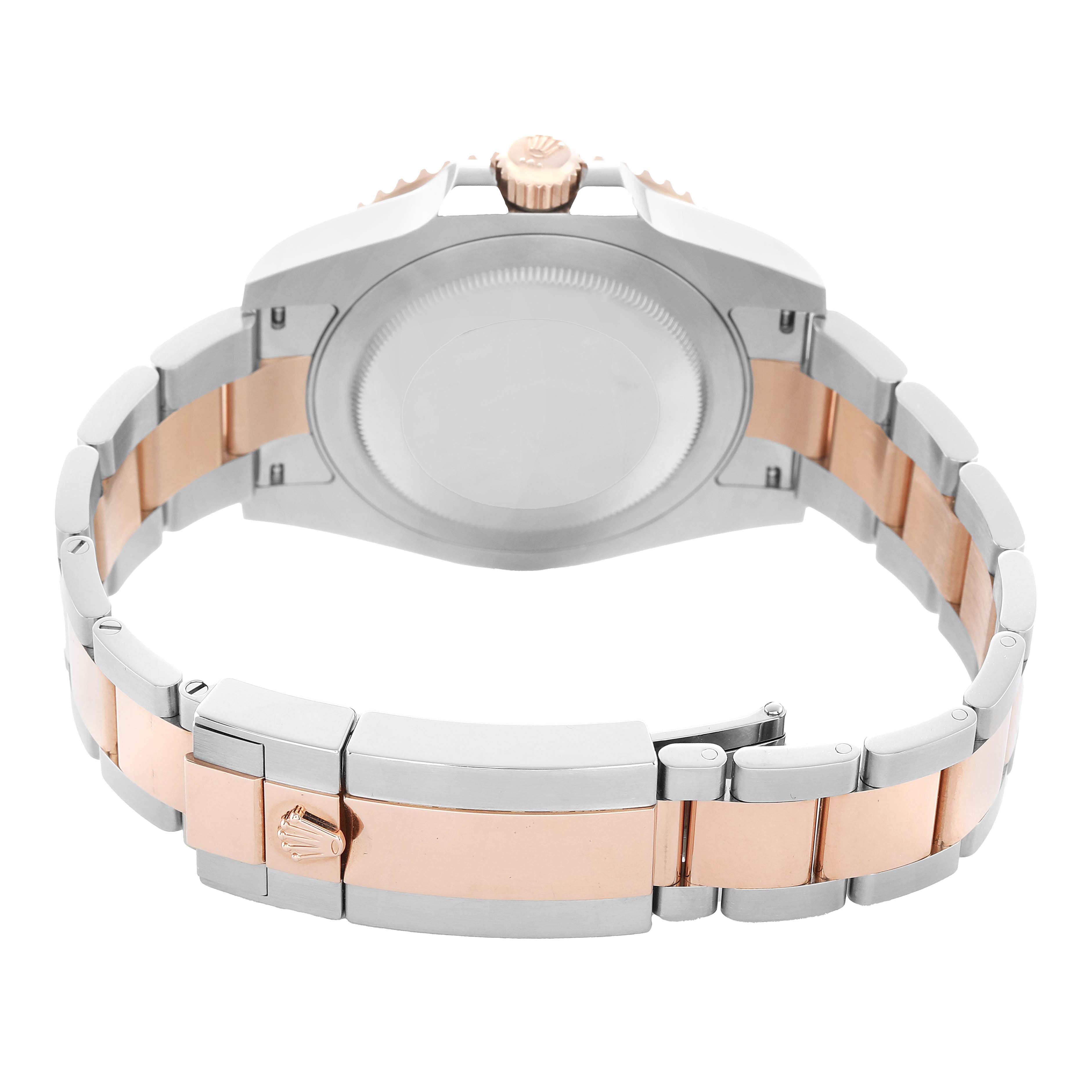 The image shows the back and clasp of a Rolex GMT-Master 126711 Men's Steel and Gold (two tone) Black Dial watch, highlighting the bi-metal bracelet and crown.