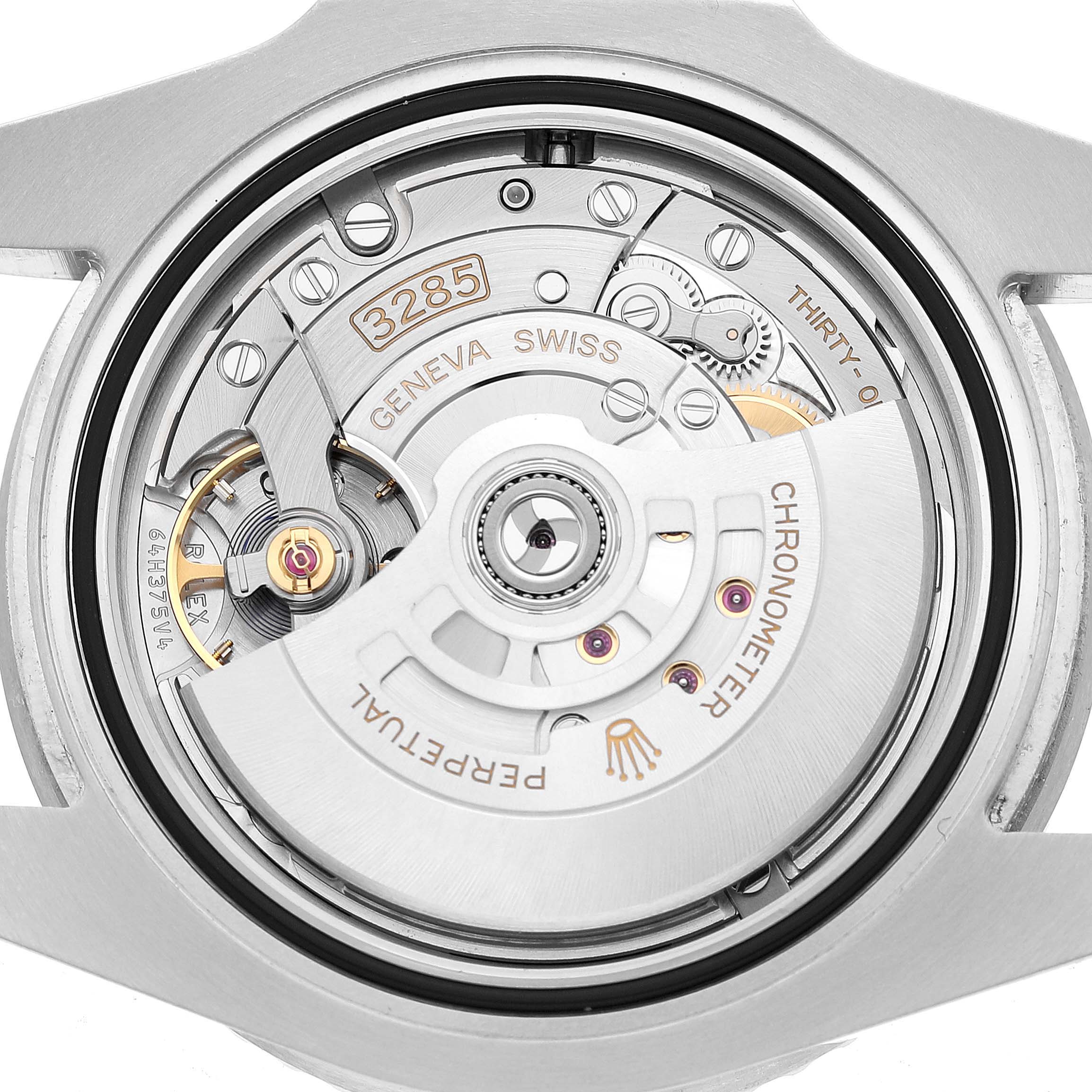 The image shows the movement of a Rolex GMT-Master 126720VTNR Men's Stainless Steel Black Dial, focusing on the rotor and gears.