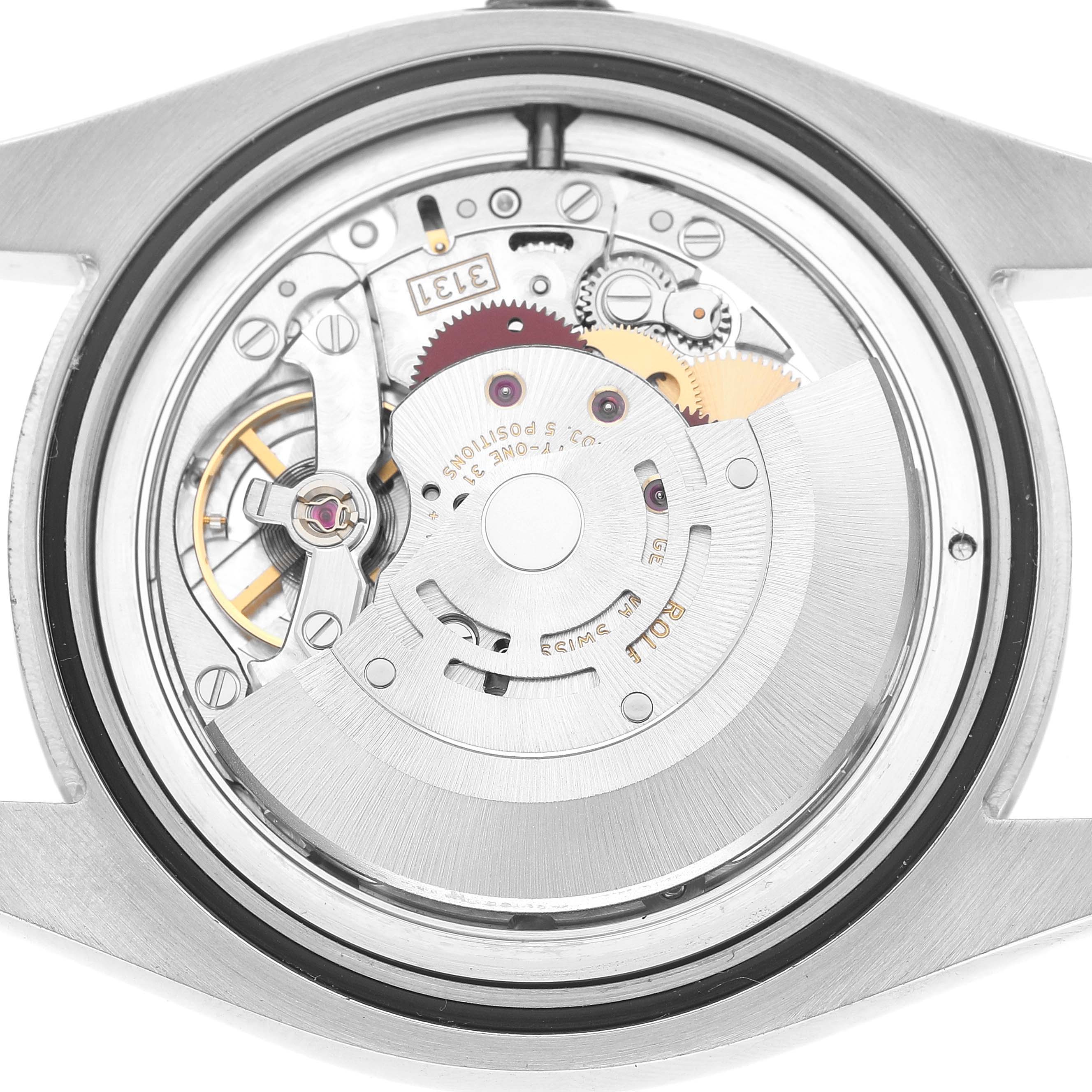 The image shows the back view of a Rolex Milgauss 116400GV Men's Stainless Steel Black Dial watch, revealing its internal movement and gears.